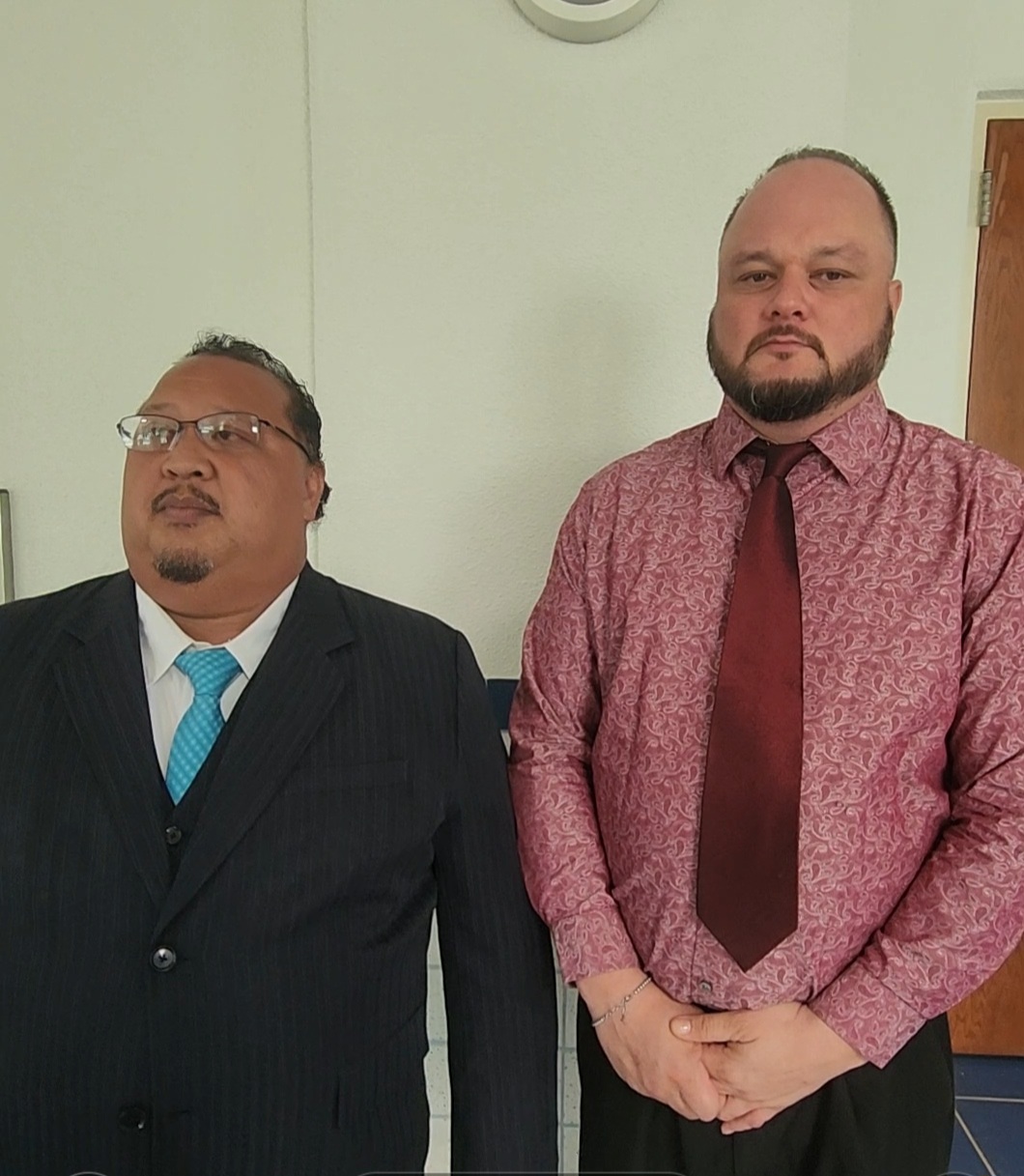 Attorney Joaquin DLG Torres, left, and his client, Shayne B. Villanueva, are interviewed by reporters following the court's not-guilty verdict.