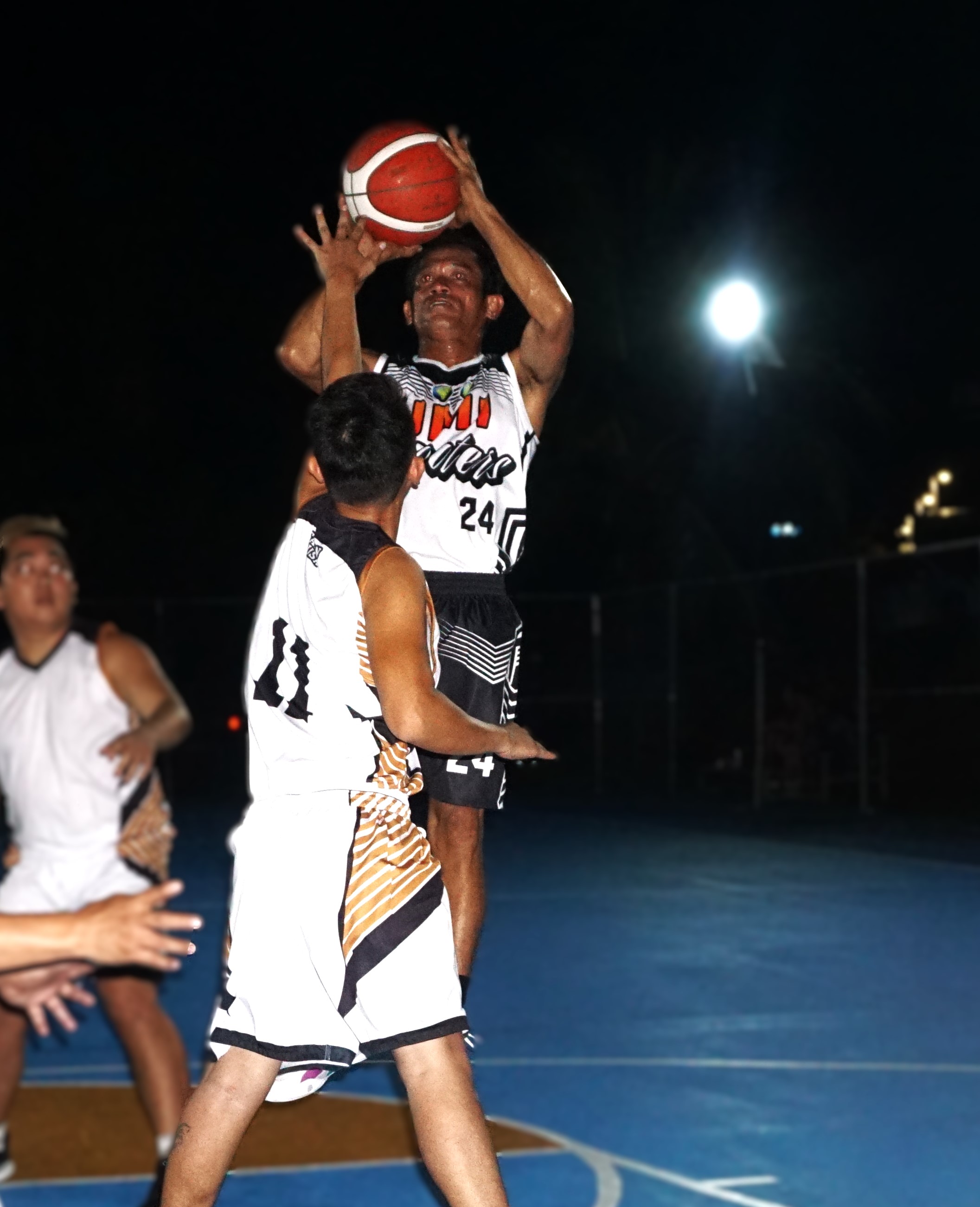 UMI's Reynante Reynante takes the contested jump shot during a game against Tsingtao JTM in the Win Pacific Corporation Invitational Basketball League 2024 at the Gualo Rai court on Tuesday. 