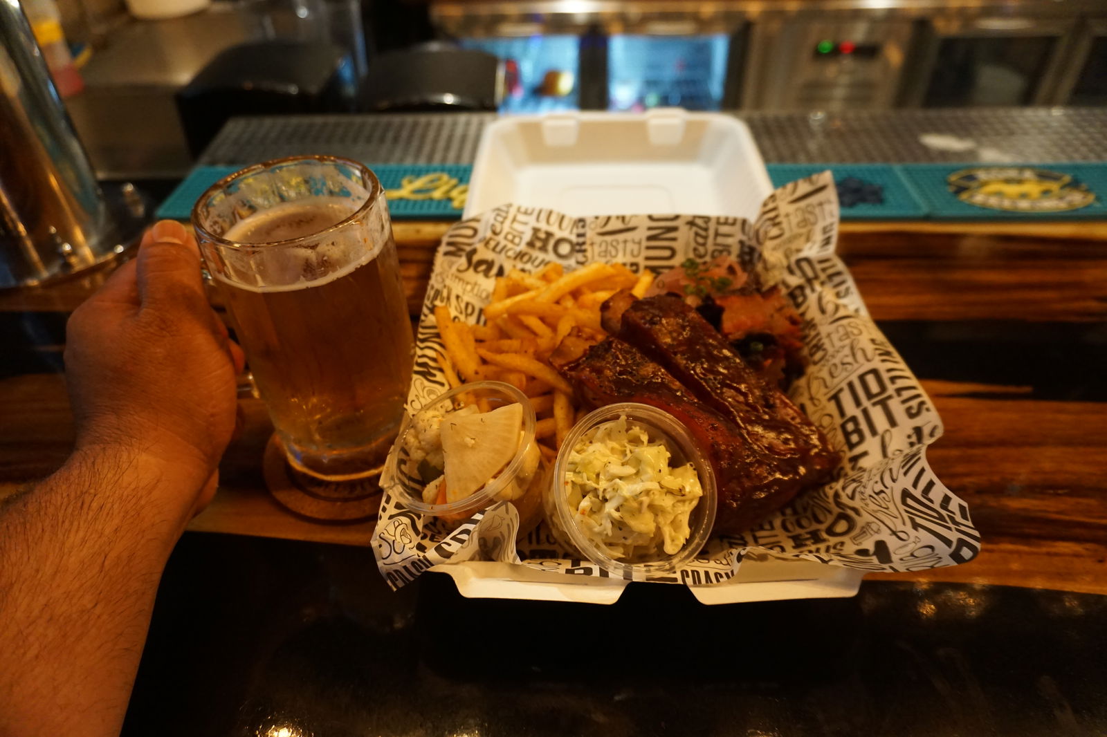 Brisket, ribs, fries and more go amazing with the Napu Brewing Co. products at Tapped Out. ​