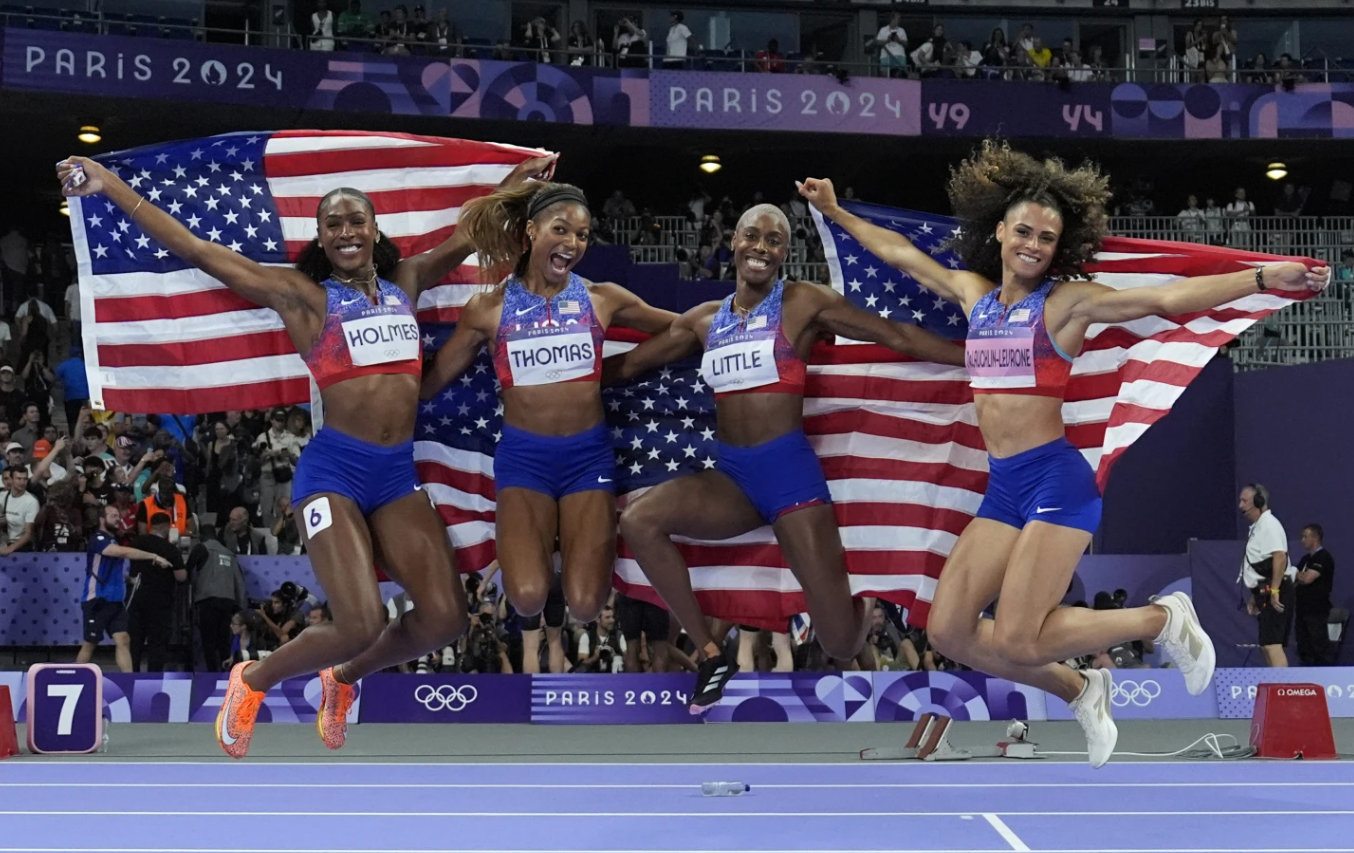 The U.S. women’s 4x400-meter relay team celebrates winning the gold medal at the 2024 Summer Olympics, Saturday, Aug. 10, in Saint-Denis, France.