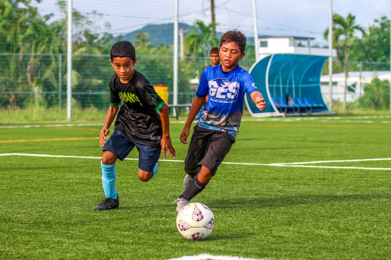 Garapan Elementary School Team 2’s Joven Sablan controls the ball during an elementary coed game of the NMI Football Association Interscholastic Soccer League at the NMI Soccer Training Center in Koblerville.