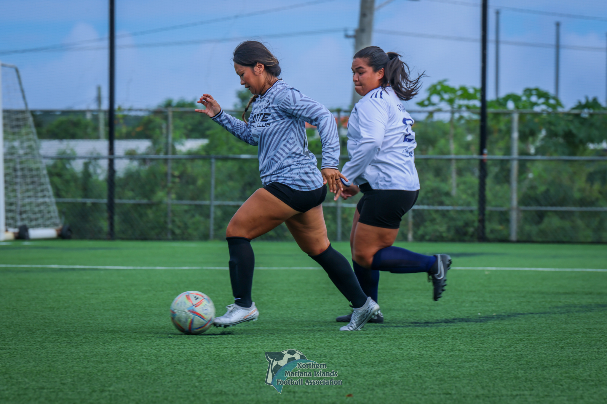 Latte FC's Jennifer Younis dribbles the ball away from a Shirley’s FC defender.