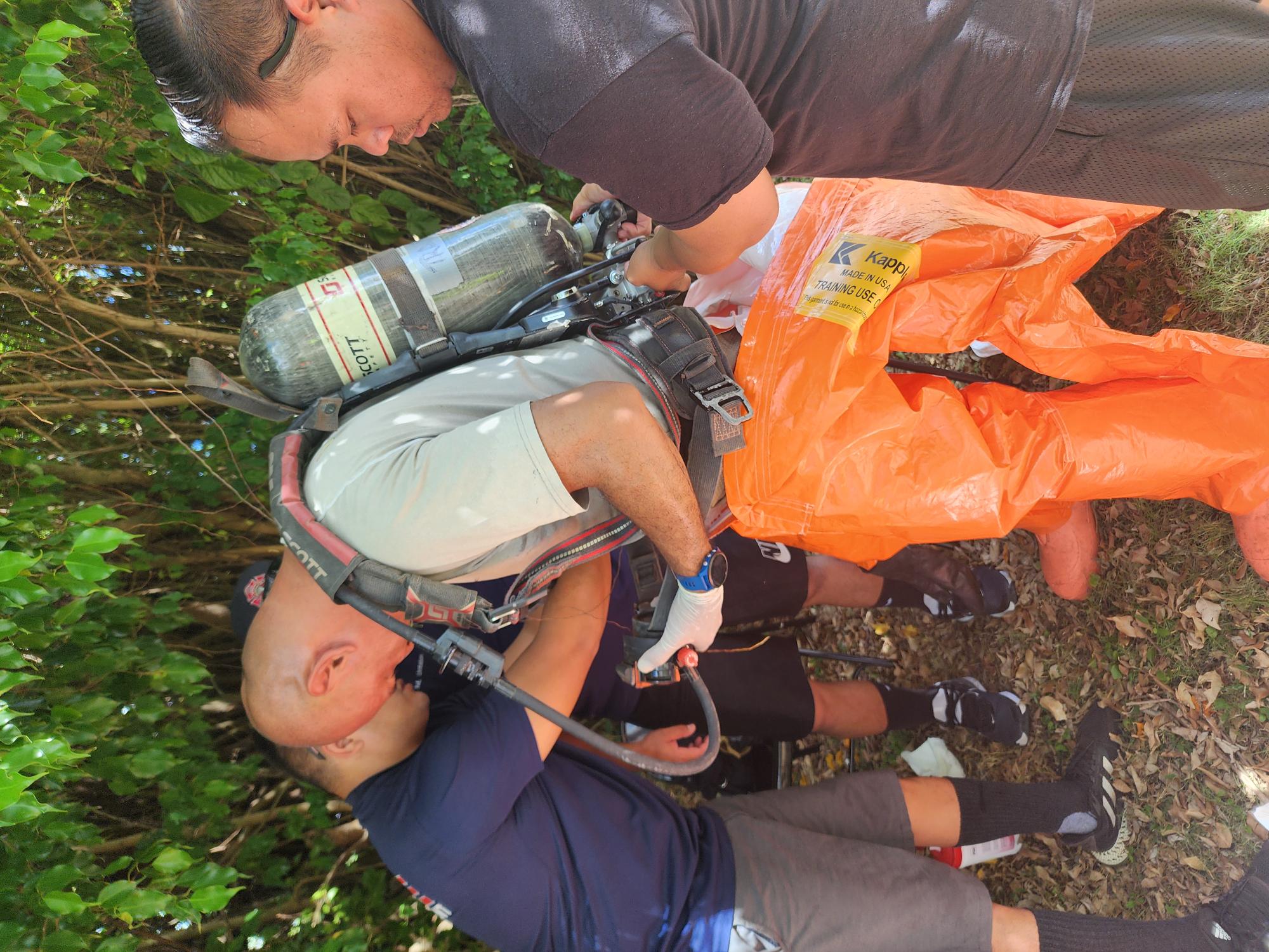 A DFEMS Hazmat responder suits up for a “gas leak” scenario during the Konfitma 2024 exercises on Wednesday.