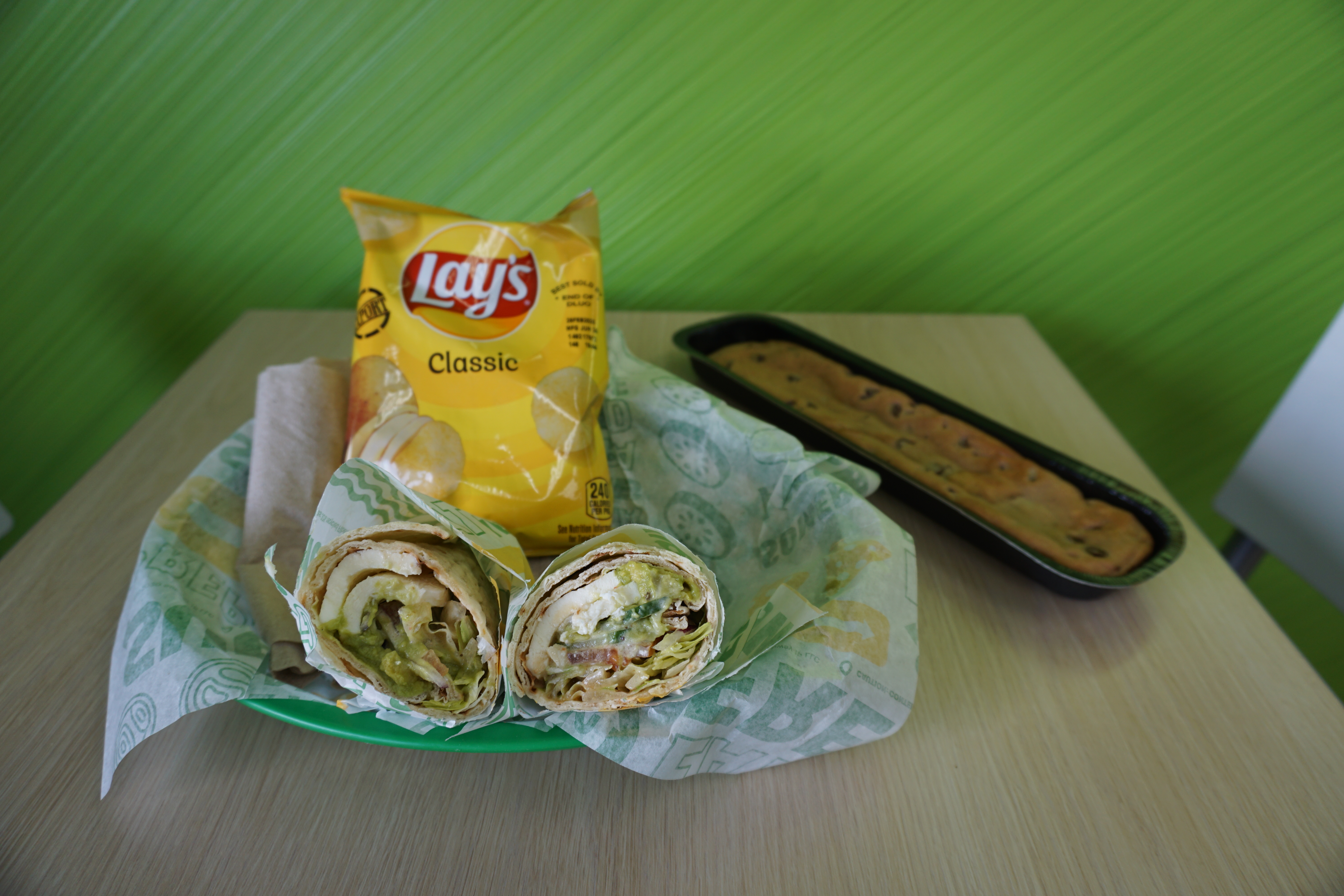 The #49 Cali Caprese features BelGioso fresh mozzarella, smashed avocado, lettuce, tomatoes, onions, cucumbers, MVP Vinaigrette, and Roasted Garlic Aioli.   