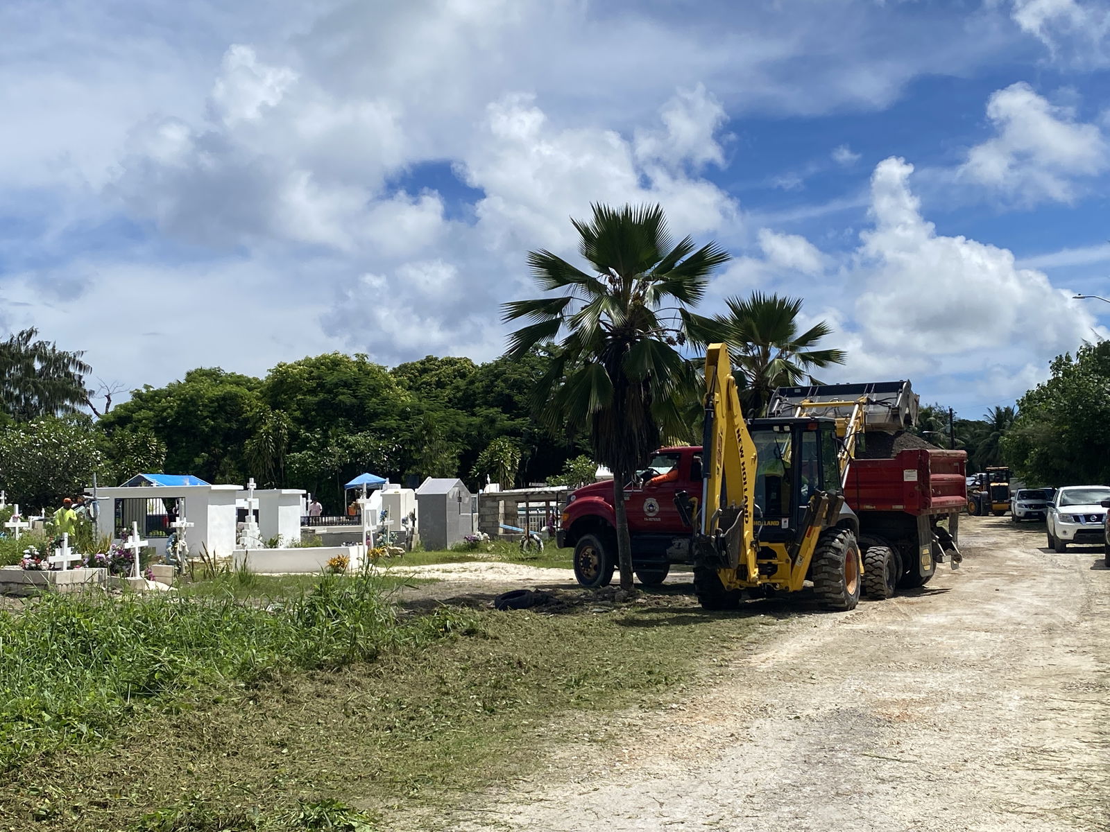 Heavy equipment is used to repair the secondary roads around the Tanapag Cemetery.