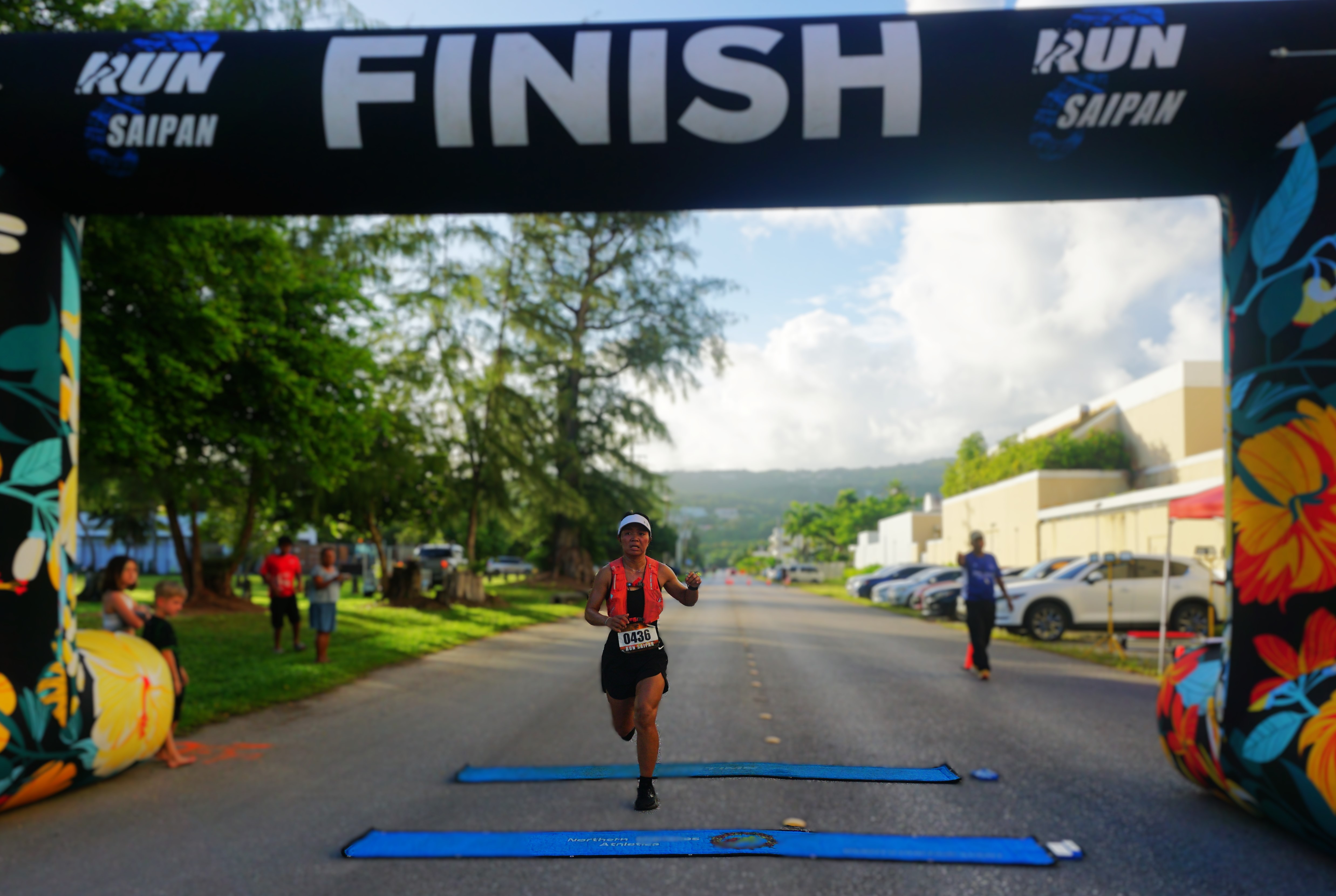 Moira crosses the finish line of the Run Saipan Labor Day Half Marathon 2024 at American Memorial Park on Saturday morning.