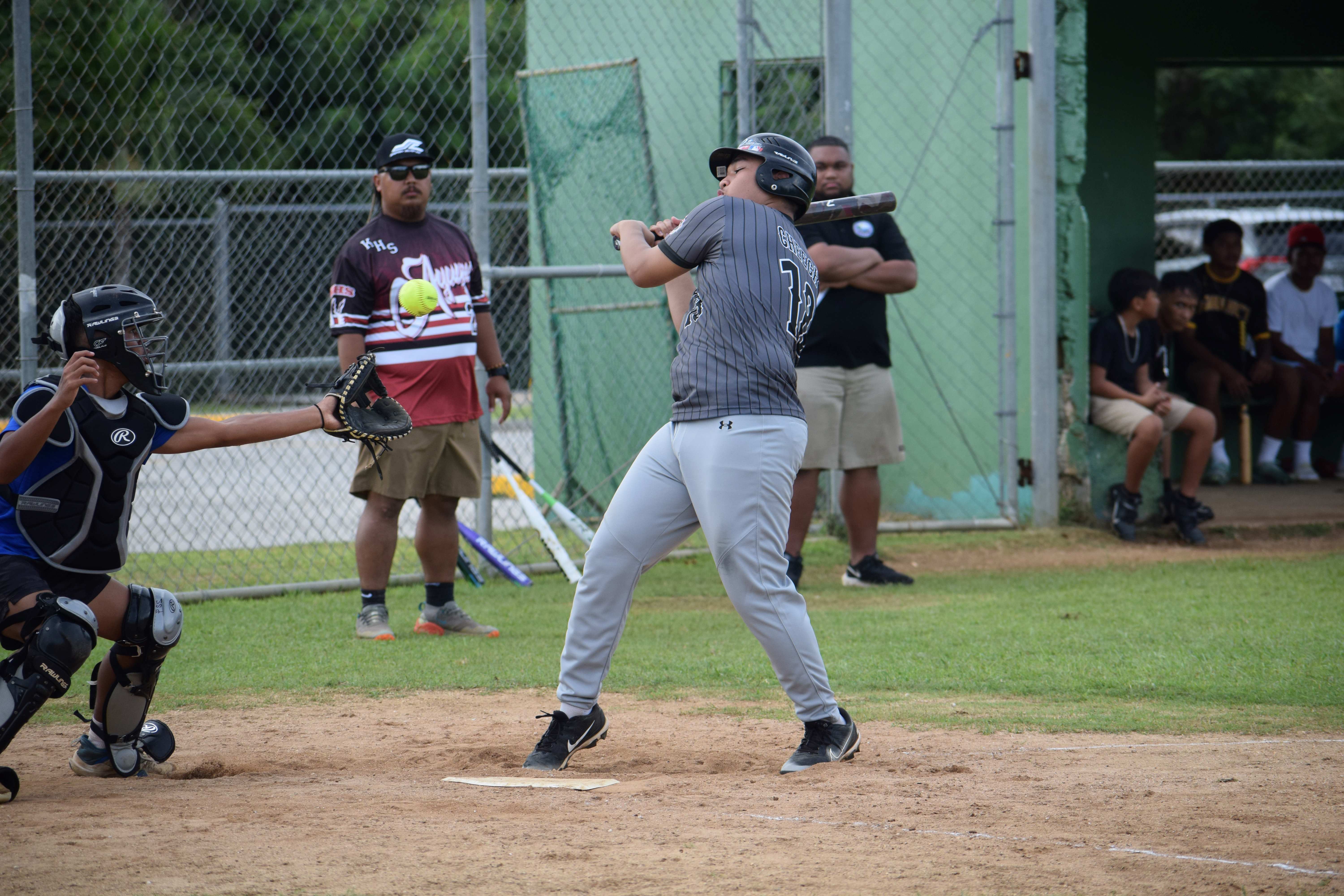 Marianas High School's Thomas Chong avoids a high ball.