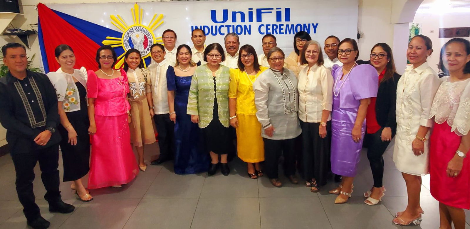 Rodney Cabarles, fifth left, and the other officers of the United Filipinos Association in Tinian pose for a photo with Philippine consulate officials during an induction and oath-taking ceremony at JC Café on Tinian, Sunday.