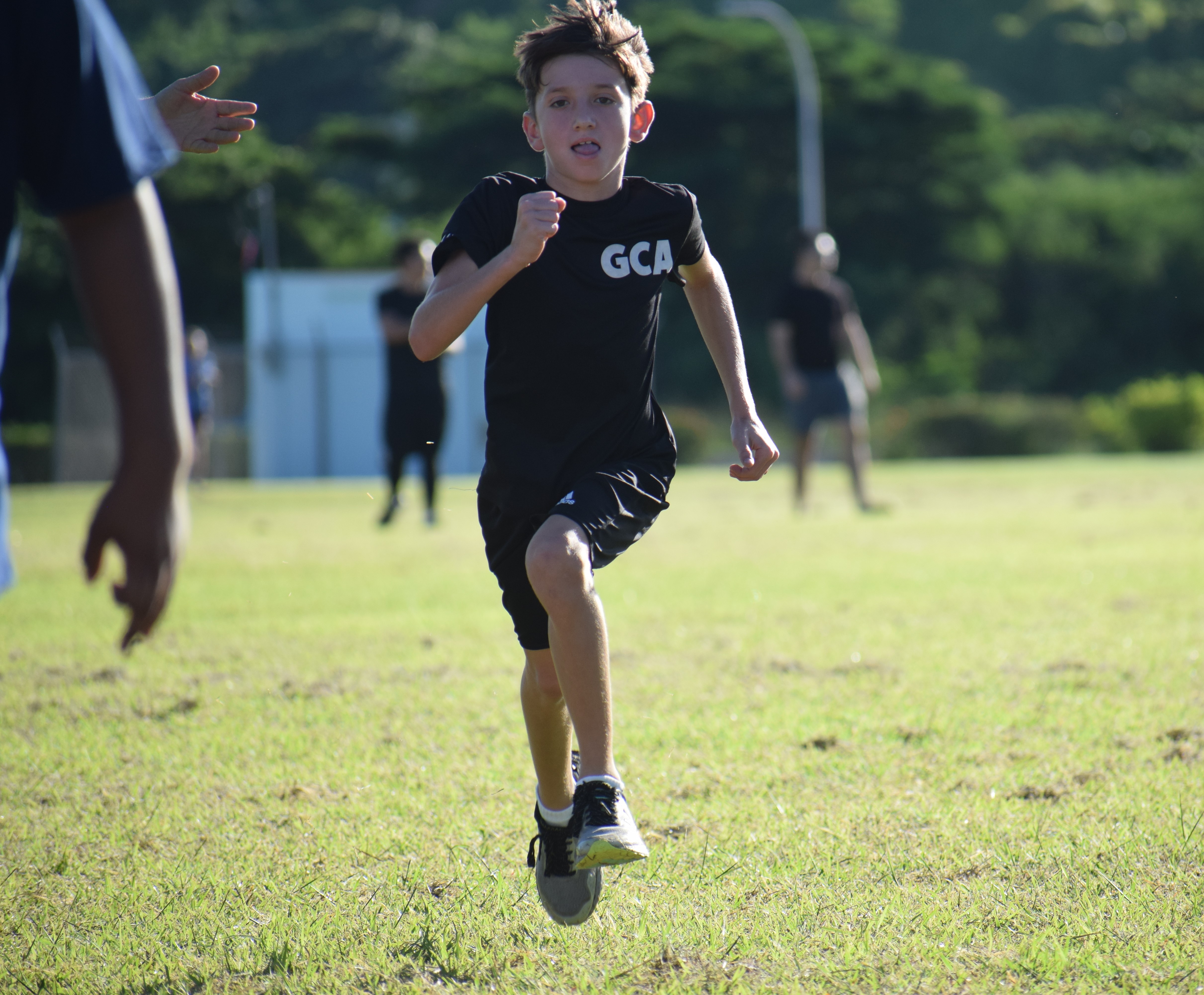 Grace Christian Academy’s Beau Bauer approaches the finish line in the elementary boys race.