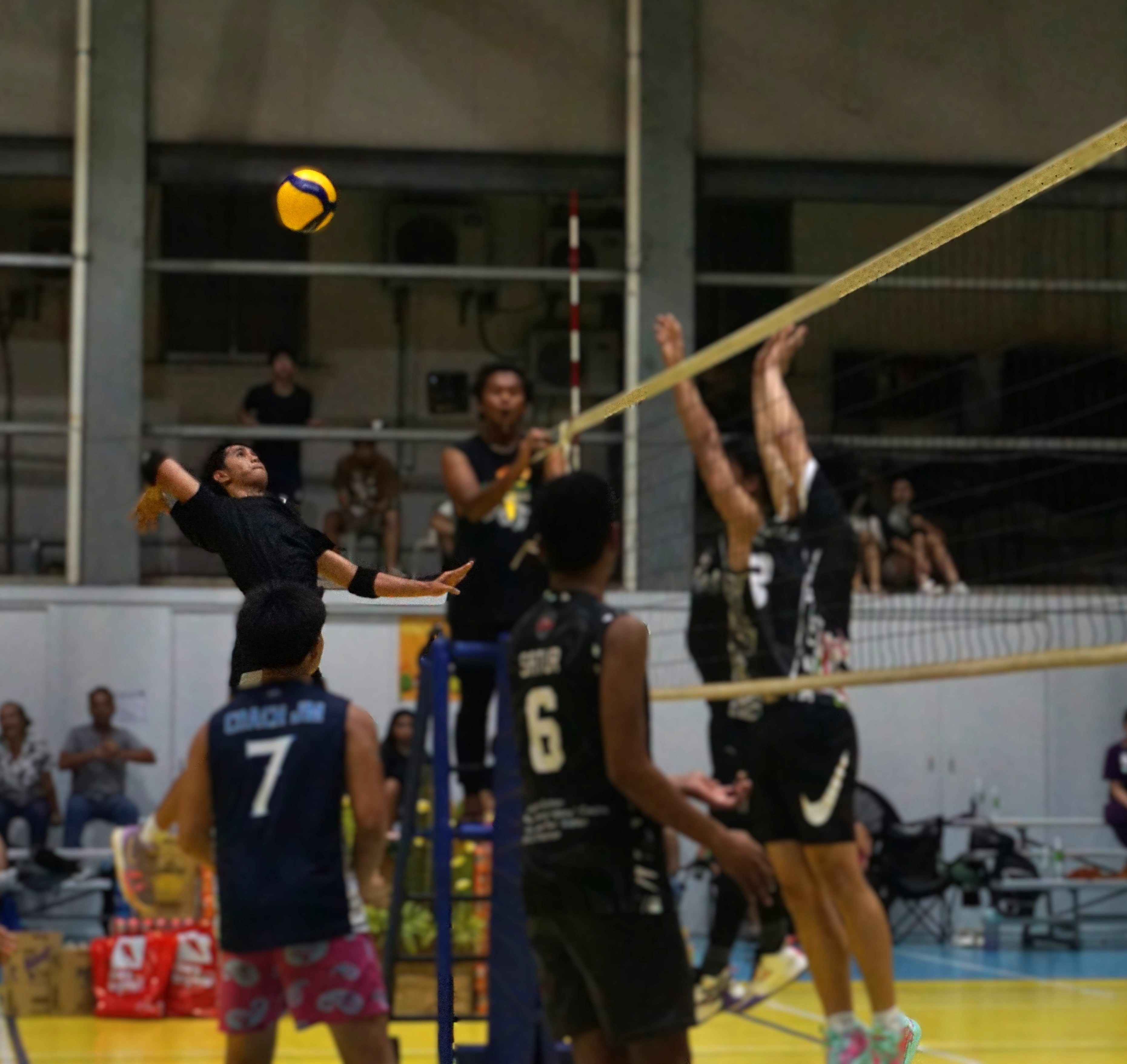 The Bomba's Jerome Manzon winds up for the spike against Bench Warmers in the men’s division championship match of the Fall Fest Volleyball Tournament 2024 at the Agape Gymnasium on Saturday.