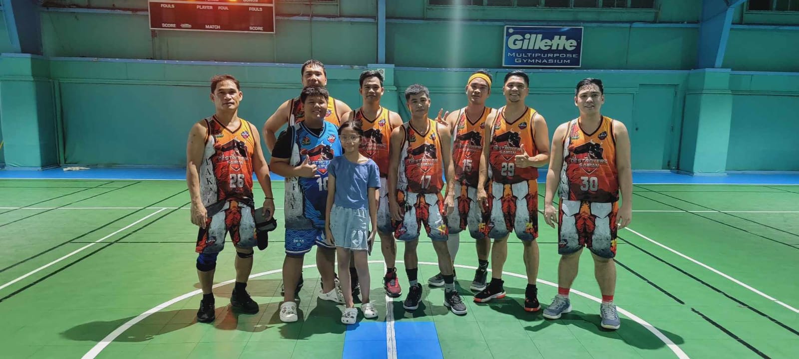 Members of the Solid Lakay team pose for photo after a Destroyers Basketball Club Friendly Game at the Tan Siu Lin Sports Center on Tuesday.