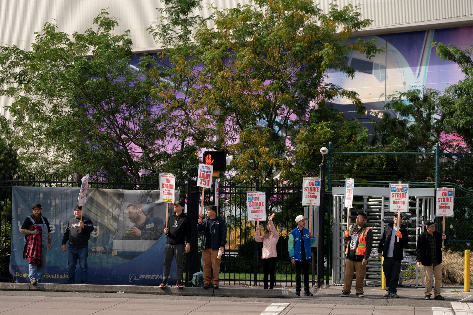 Boeing factory workers and supporters gather on a picket line during the third day of a strike near the entrance to a Boeing production facility in Renton, Washington, Sept. 15, 2024.