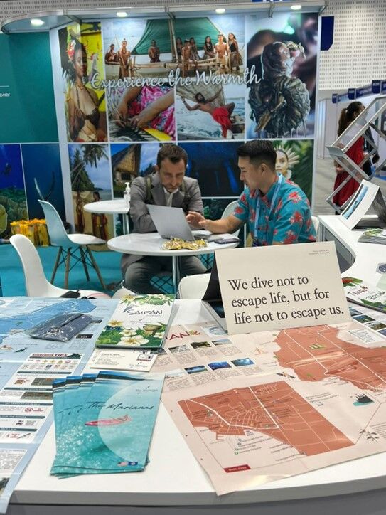Marianas Visitors Authority Marketing Manager Thomas Kim, right, shares details about the Marianas with a prospective buyer at PATA Travel Mart 2024 on Aug. 27-29, 2024, in Bangkok, Thailand.