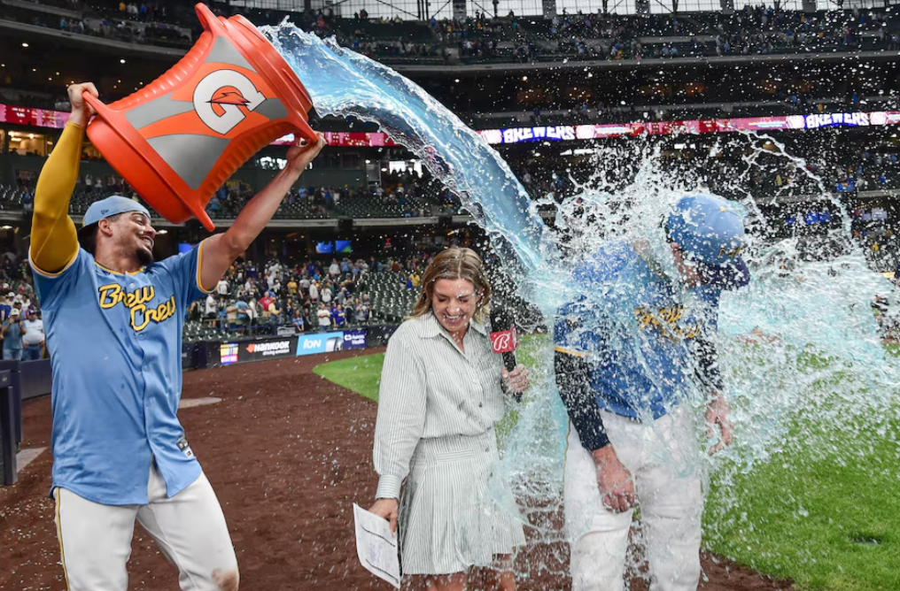 Milwaukee Brewers designated hitter Jake Bauers (9) is dunked by shortstop Willy Adames (27) after beating the Arizona Diamondbacks at American Family Field in Milwaukee, Wisconsin, Sept. 22, 2024.
