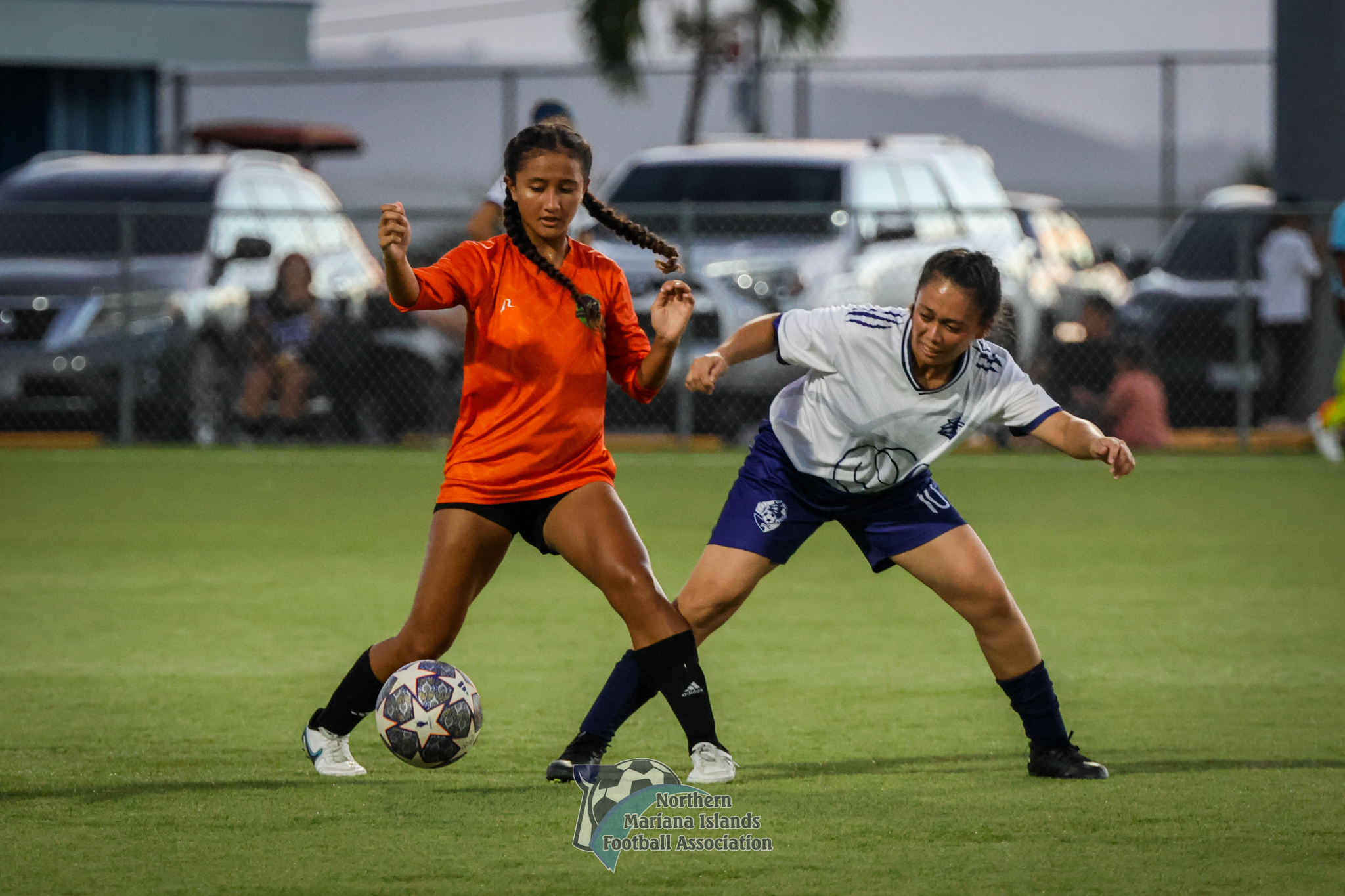 Beatrice Gross, left, playing for Kanoa FC in the Dove Women's League, secures the ball from a defender.