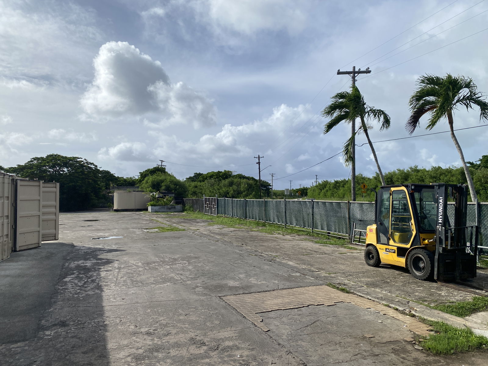 This is where two thieves jumped over the fence to get the golf carts. They then drove down this road toward Koblerville.  