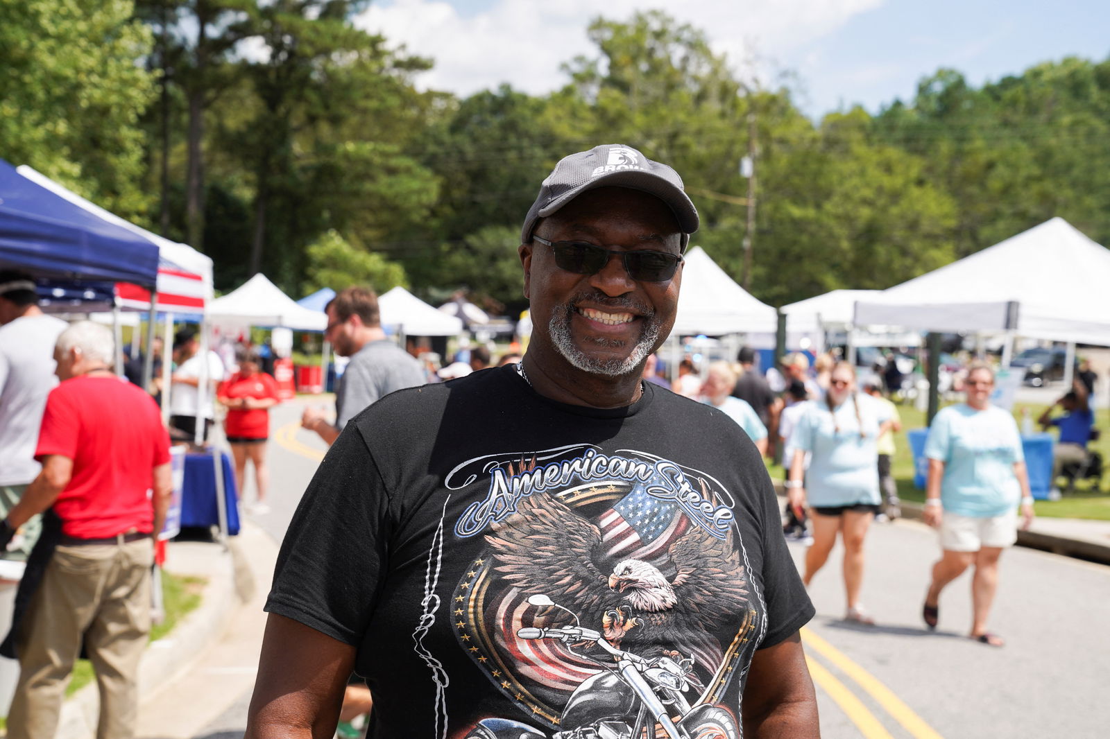 Freeman Moore, a Trump supporter, poses for a portrait at the Pigs and Peaches country festival in Kennesaw, Georgia, Aug. 17, 2024.