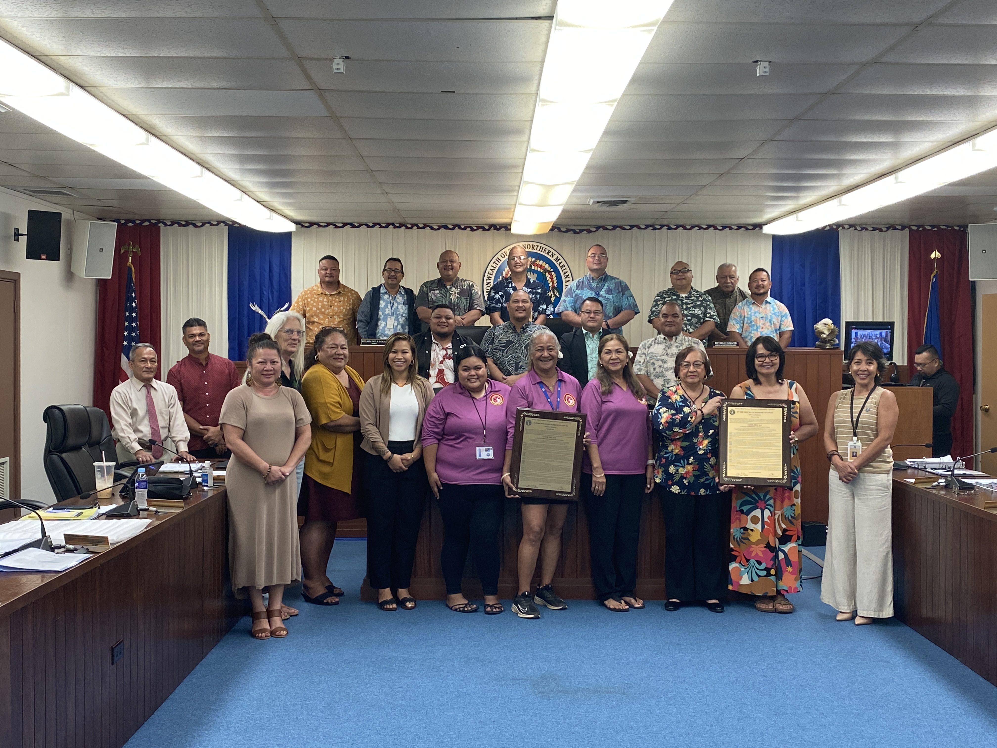 House members pose for a photo with Women’s Affairs Office officials and CNMI Women's Association members in the House chamber on Friday, Aug. 30, 2024.  