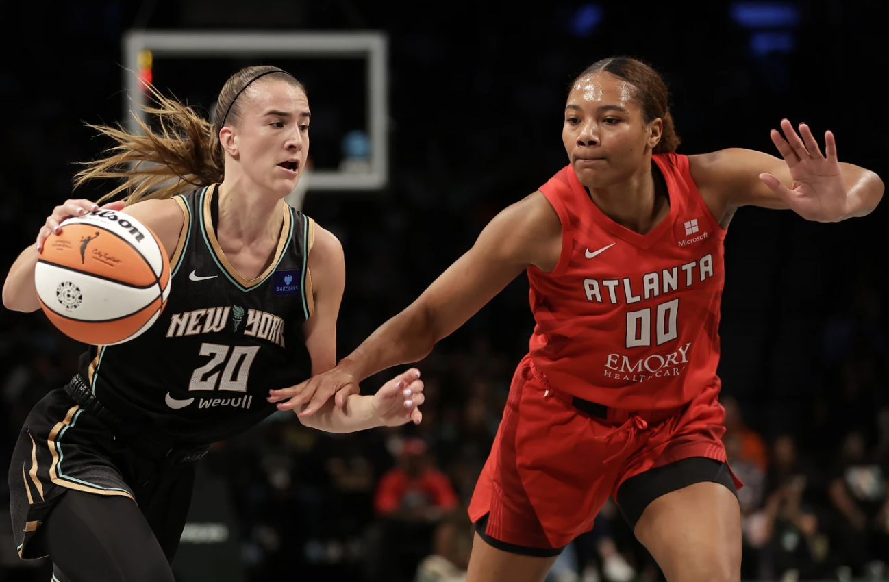 New York Liberty Sabrina Ionescu (20) drives past Atlanta Dream forward Naz Hillmon during the first half of a first-round WNBA playoff game, Tuesday, Sept. 24, 202 in New York.