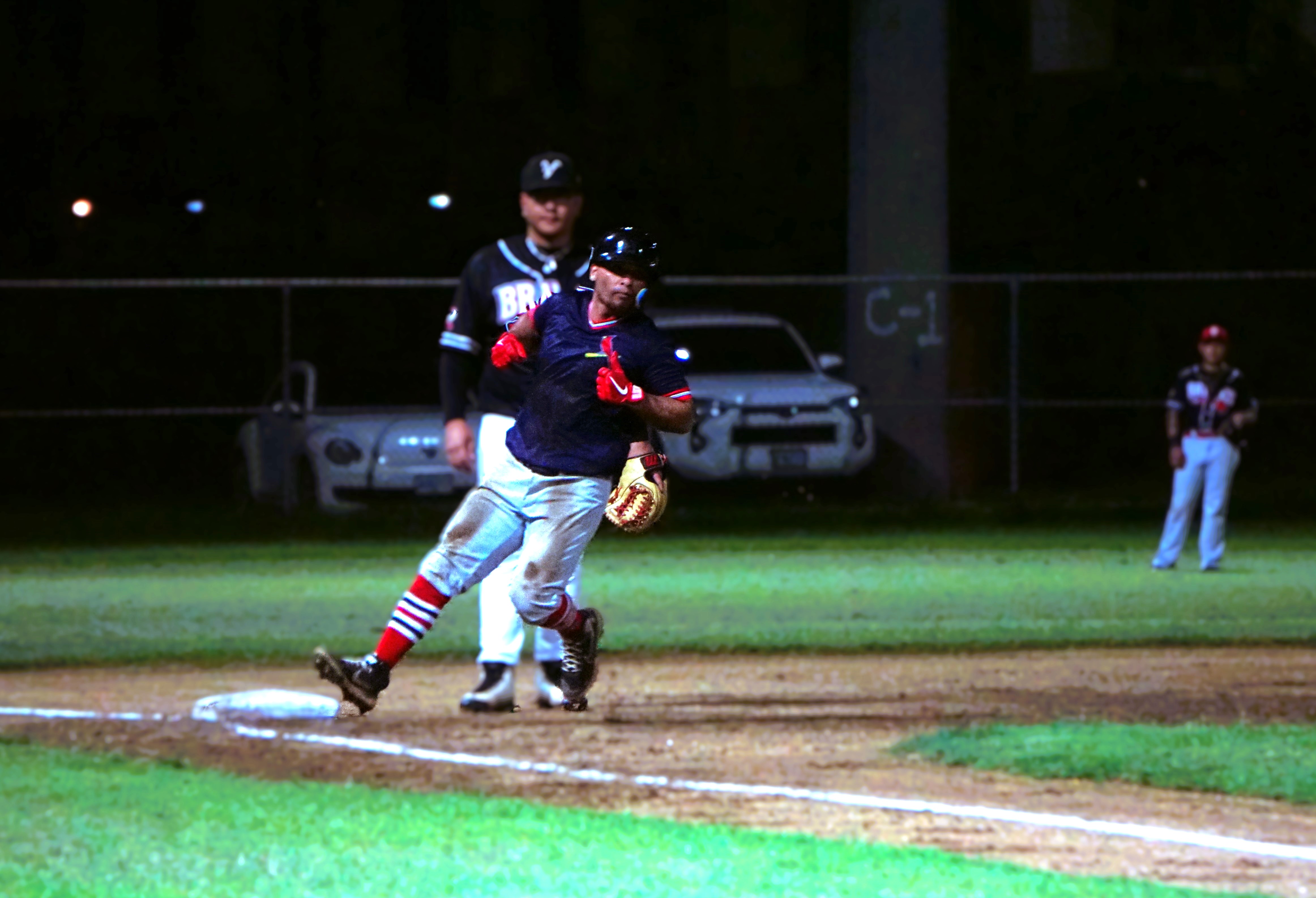 The Cardinals' Pat Tenorio makes his way safely to third base during a game in the 2024 Tan Holdings Saipan Baseball League at the Francisco "Tan Ko" Palacios Baseball Field.