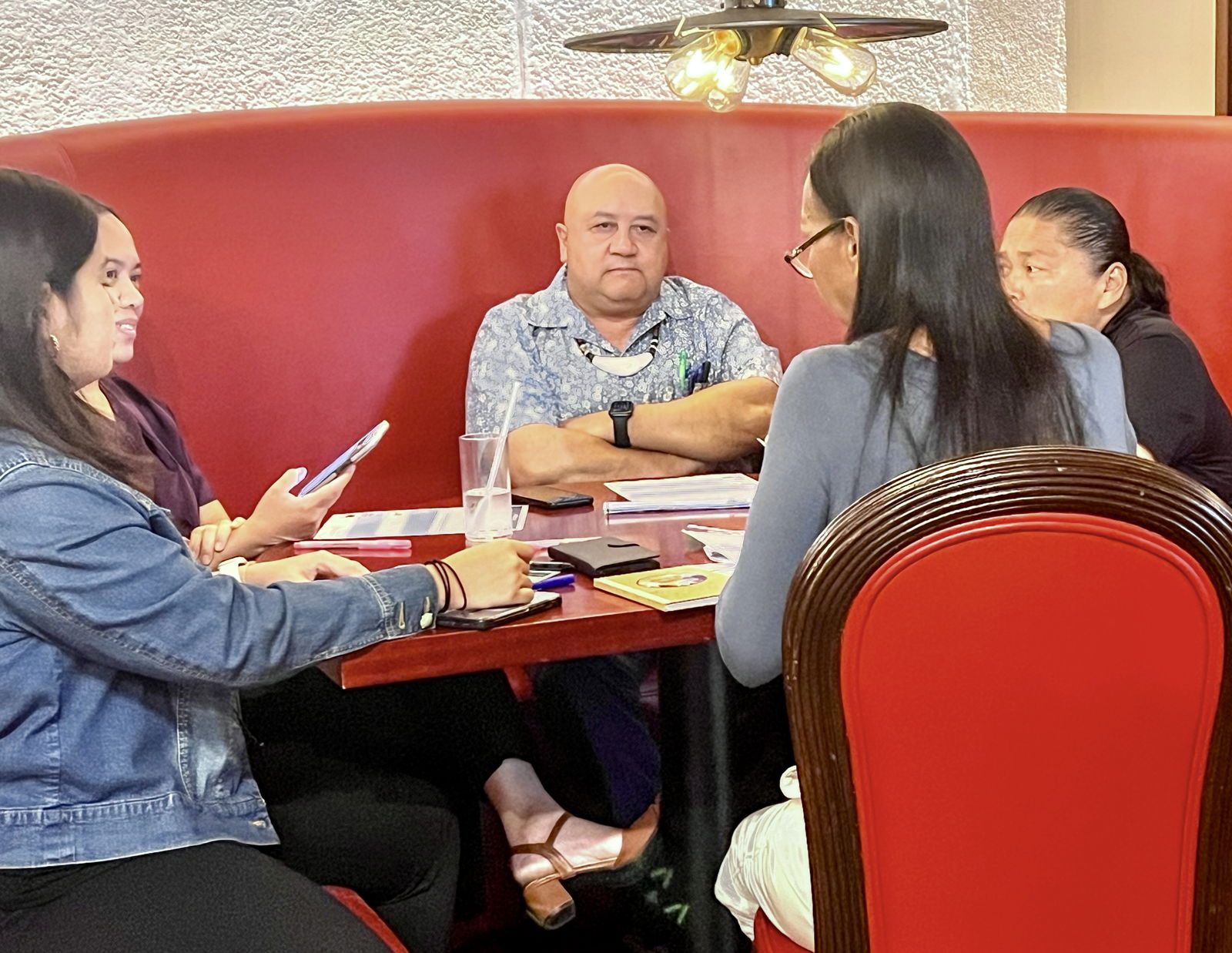 Commissioner of Education Dr. Lawrence F. Camacho, center, listens during a meeting with community stakeholders, leaders and education advocates.