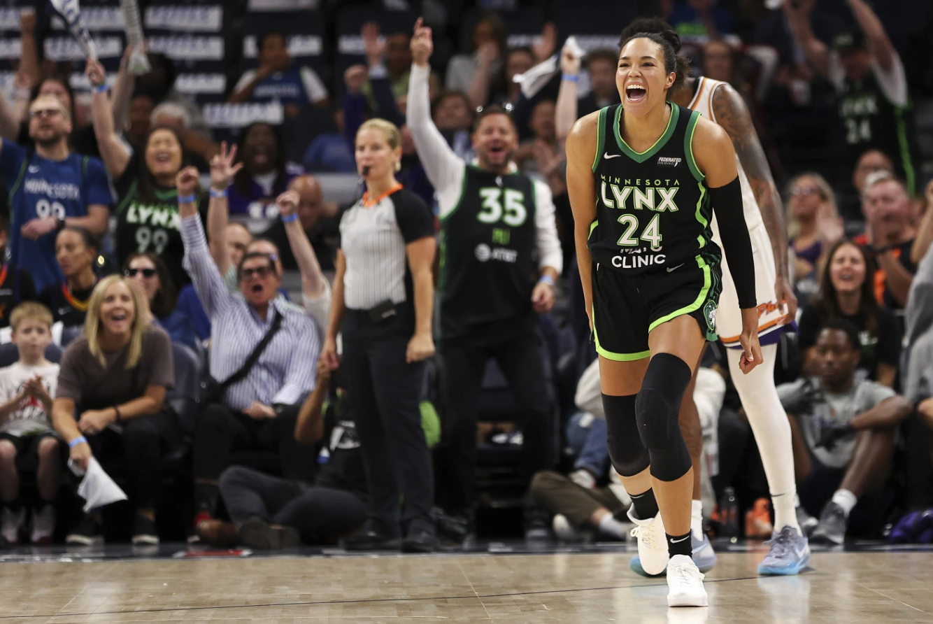 Minnesota Lynx Napheesa Collier celebrates her 3-point basket against the Phoenix Mercury during the second half of Game 1 of a WNBA first-round playoff game, Sunday, Sept. 22, 2024 in Minneapolis.