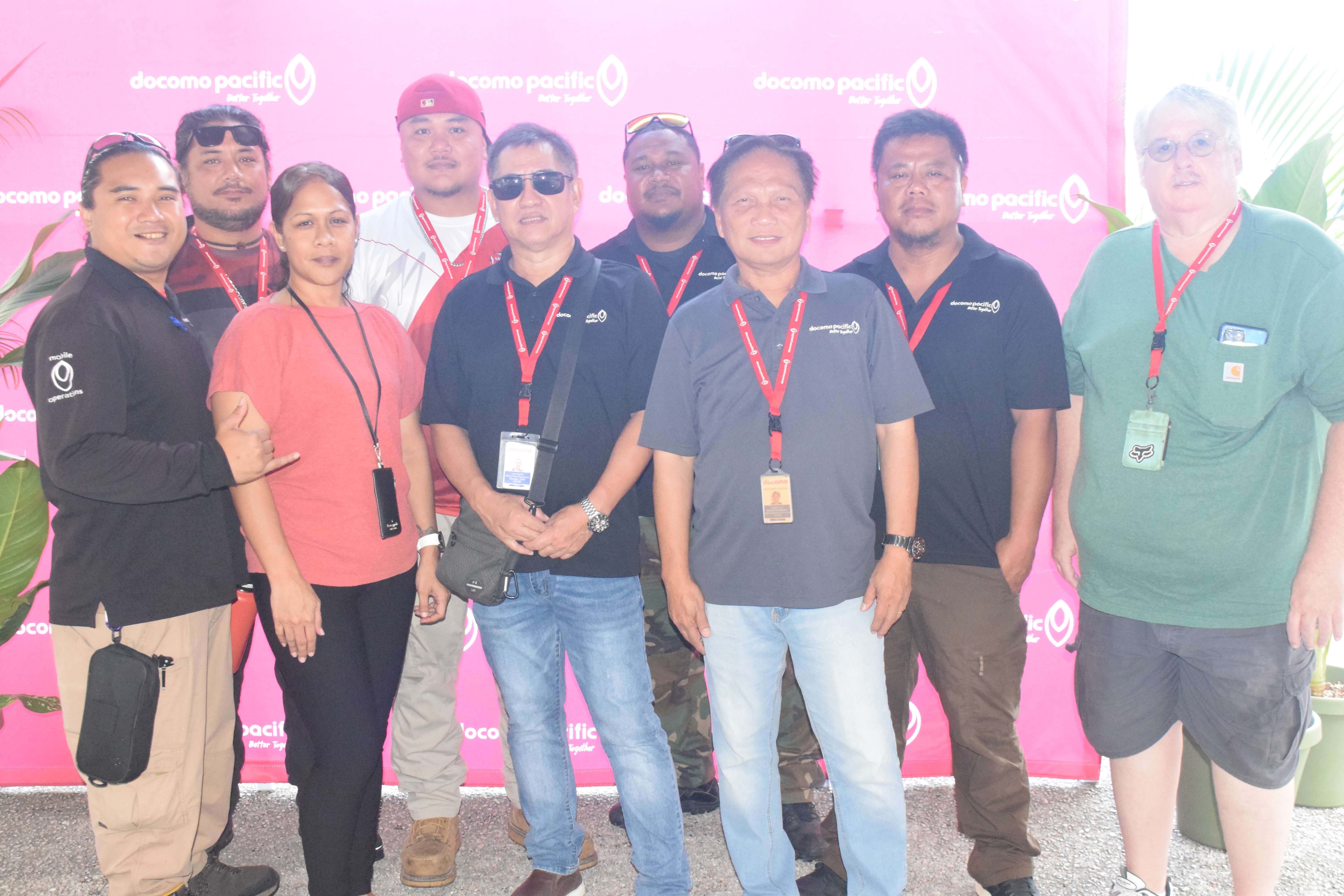 The Docomo Pacific Mobile Field Operations Team members headed by supervisor Carlo Rafols, third right, pose for photo.