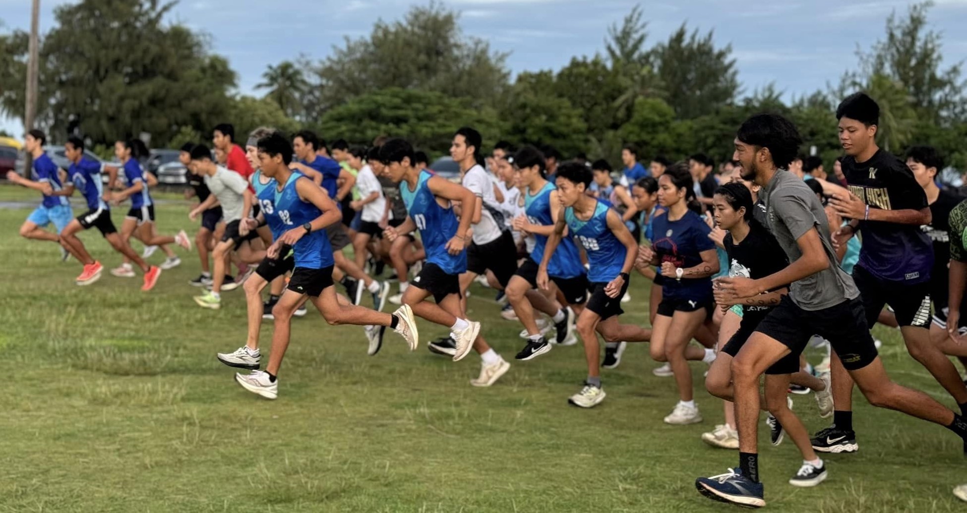 The high school boys and girls division runners take off during the Public School System Cross Country event at American Memorial Park on Saturday.