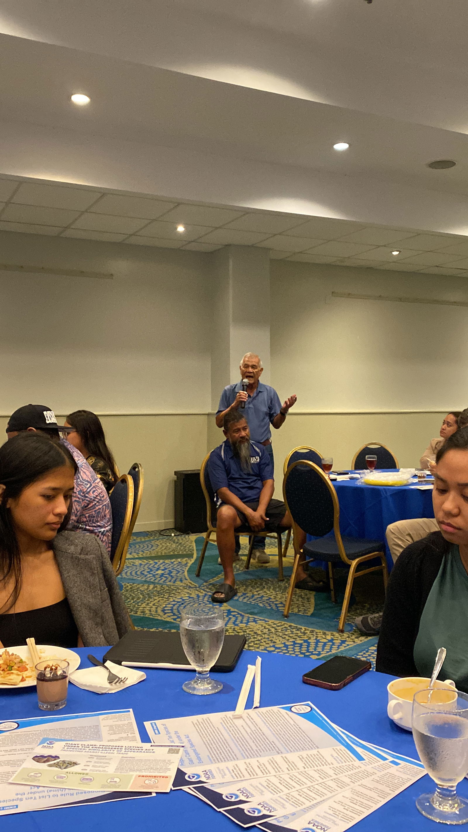 Former Rep. Juan I. Tenorio, a lifelong fisherman, speaks at the NOAA public meeting​.