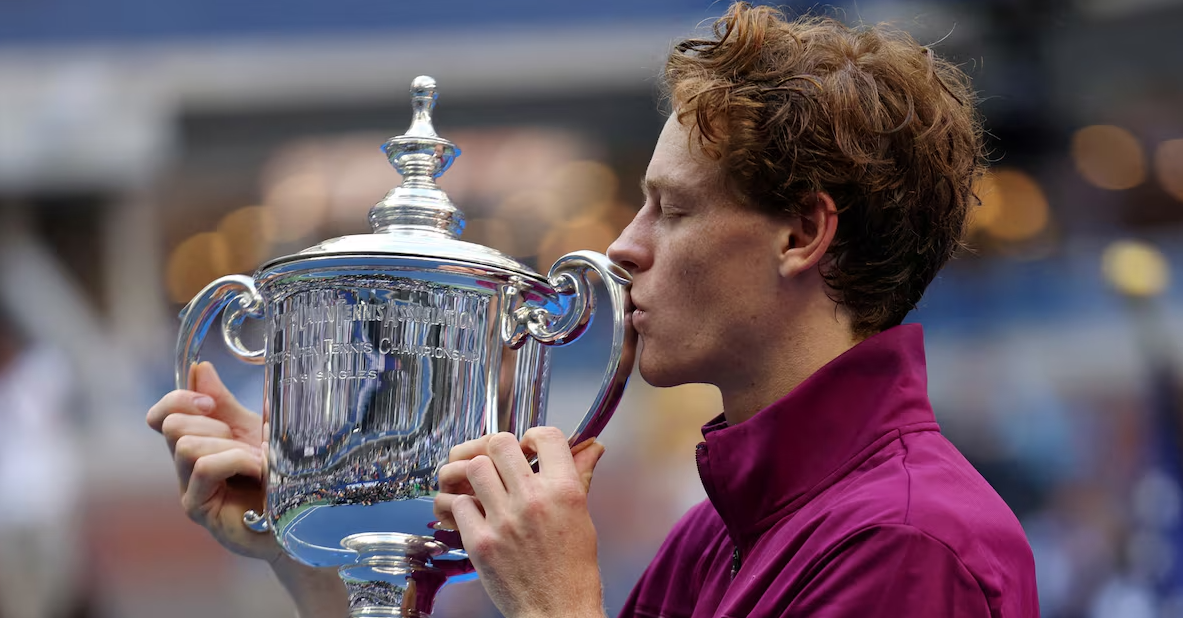 Italy's Jannik Sinner celebrates with the U.S. Open trophy after winning his final match against Taylor Fritz of the U.S. in Flushing Meadows, New York, Sept. 8, 2024