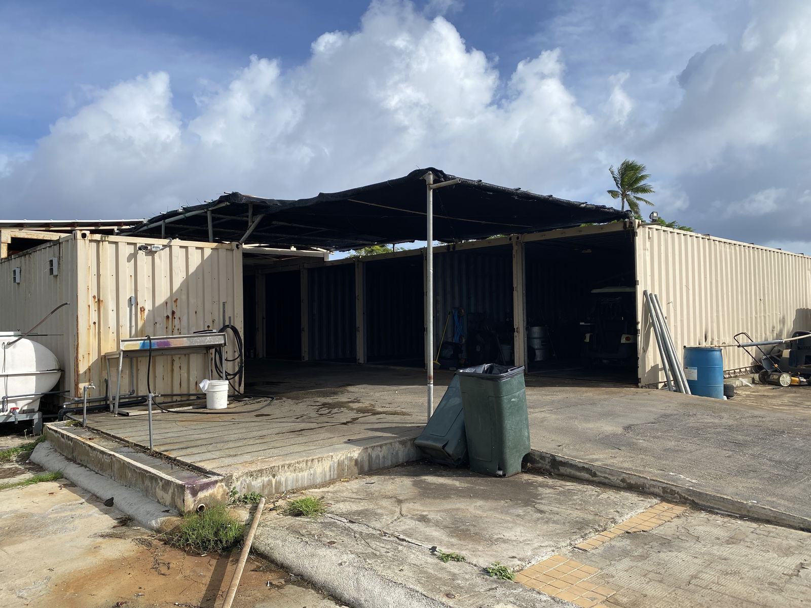 This area is used by COP to store its carts and tools. Two golf carts were parked in the open, outside of the storage container on the farthest right side of the photo.  