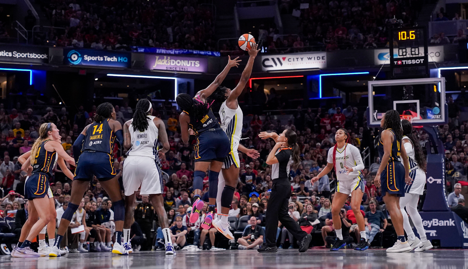Indiana Fever forward Aliyah Boston (7) and Dallas Wings center Teaira McCowan (15) leap for the ball at Gainbridge Fieldhouse in Indianapolis, Indiana, Sept. 15, 2024.