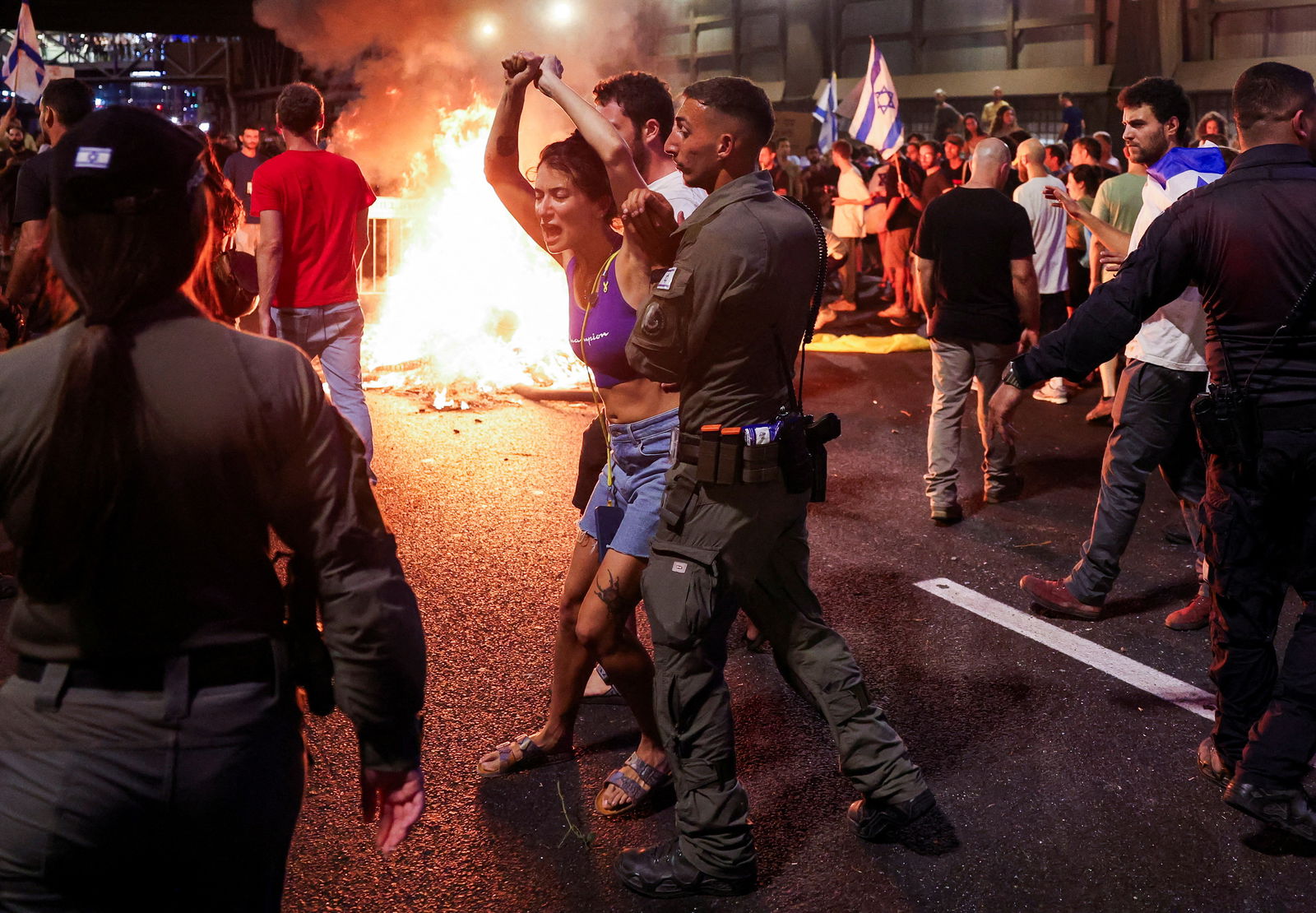 In this photo taken on Sept. 1, 2024 in Tel Aviv, Israel, a person reacts as protesters rally against the government and to show support for the hostages who were kidnapped during the deadly Oct. 7 attack, amid the ongoing conflict in Gaza between Israel and Hamas.