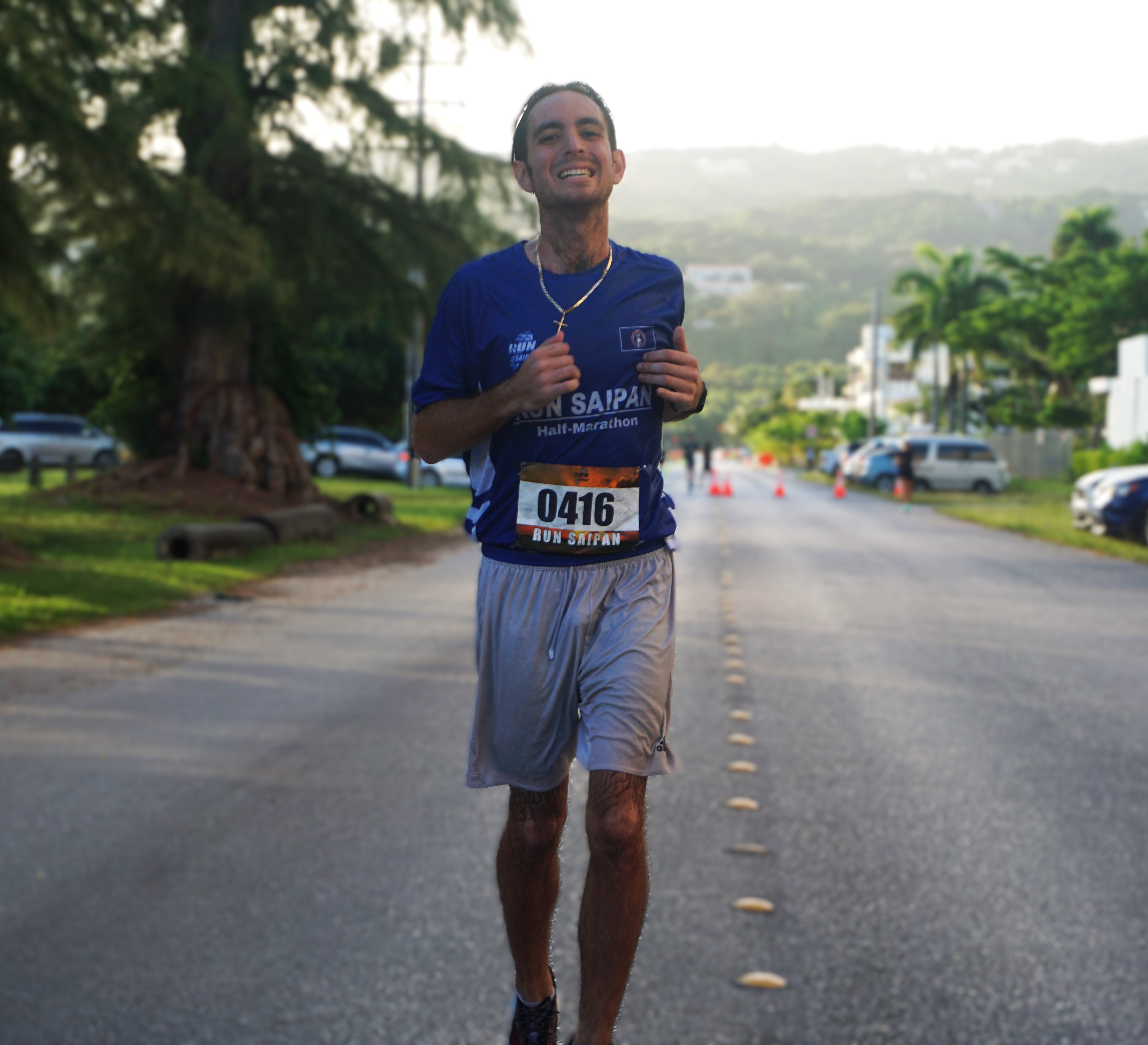 Jordan Ruiz smiles as he crosses the finish line of the Run Saipan Labor Day Half Marathon and 5K Fun Run 2024 at American Memorial Park on Saturday morning.