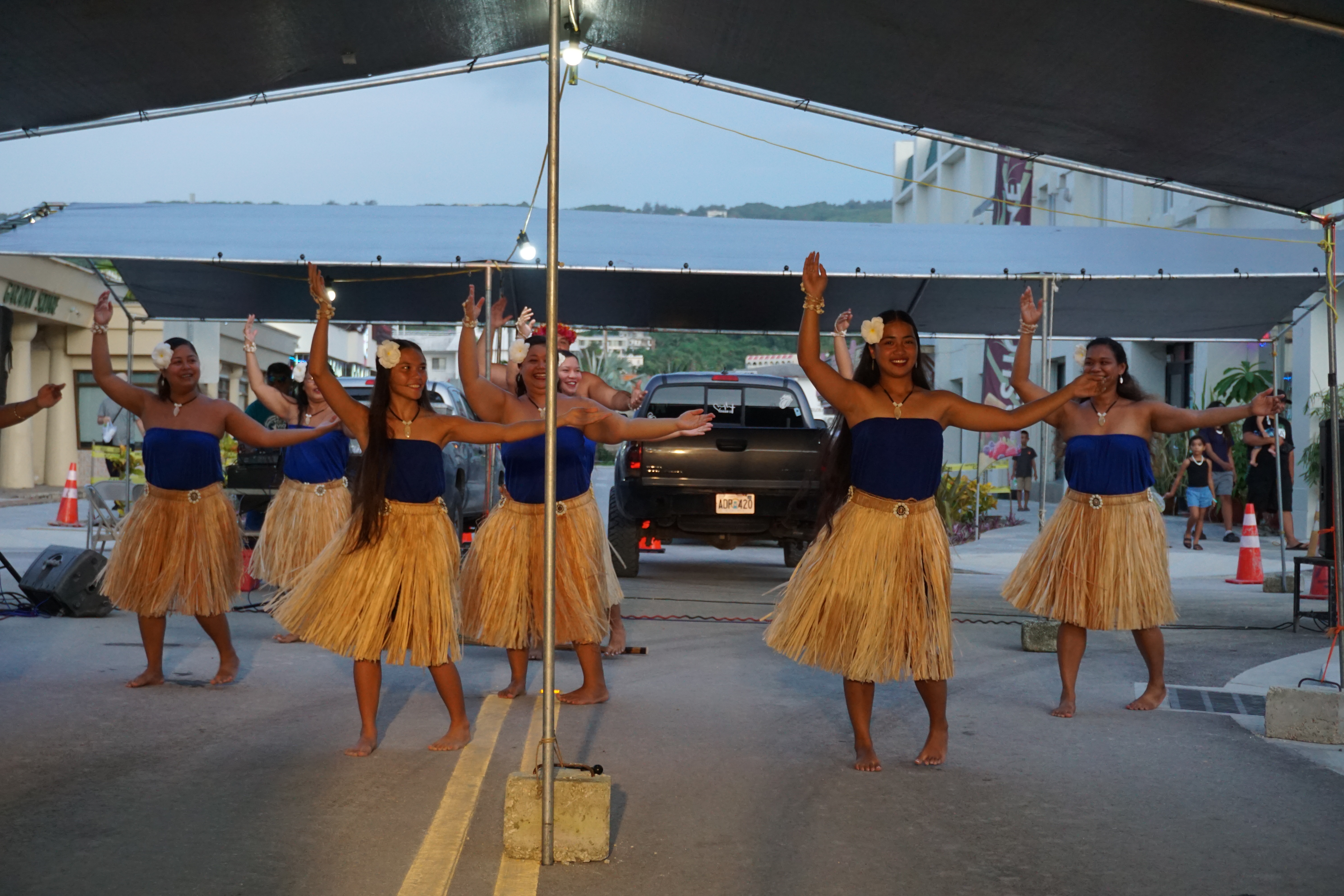 Traditional dancers perform at the street market.