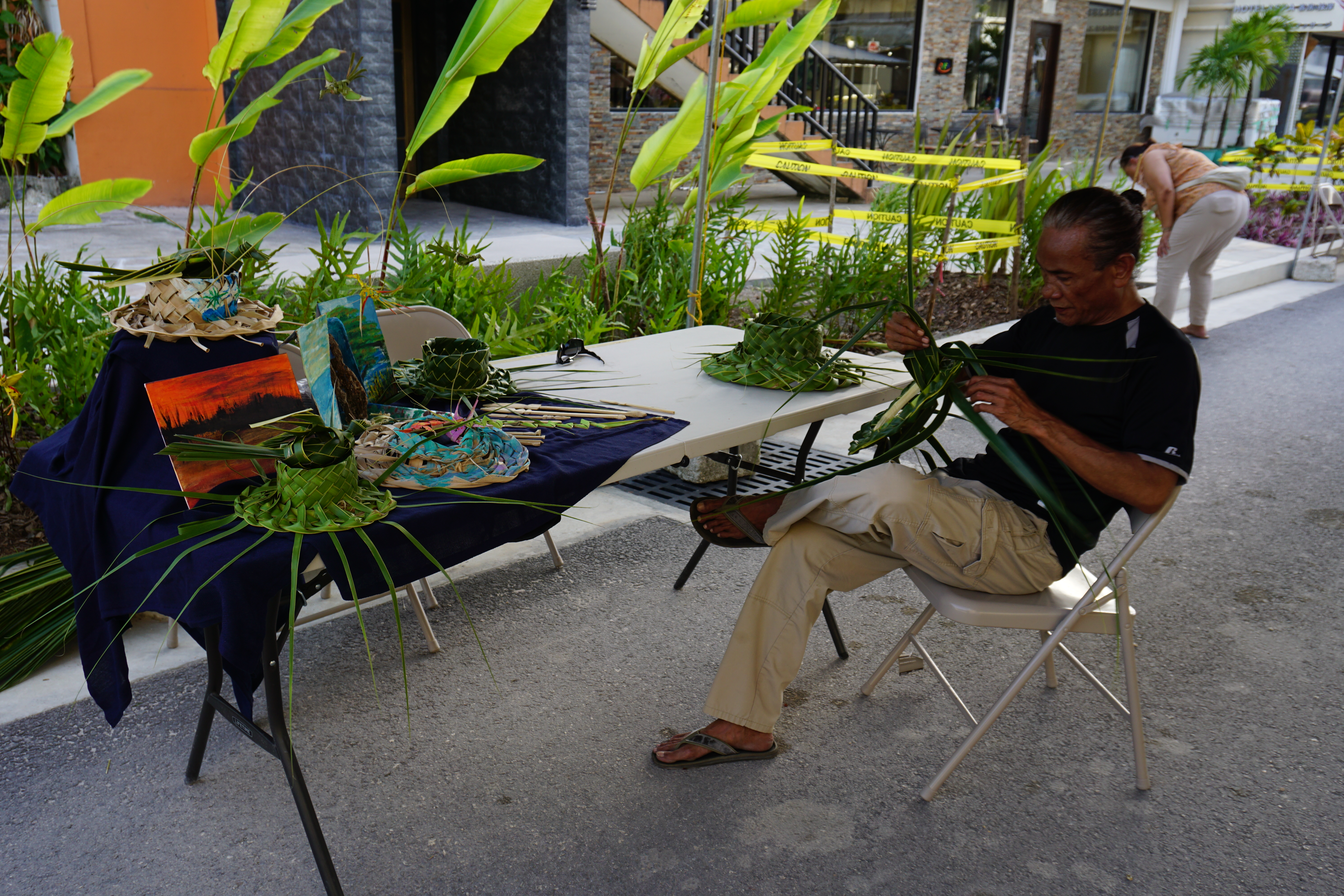 John Hosono displays his weaving skills. 