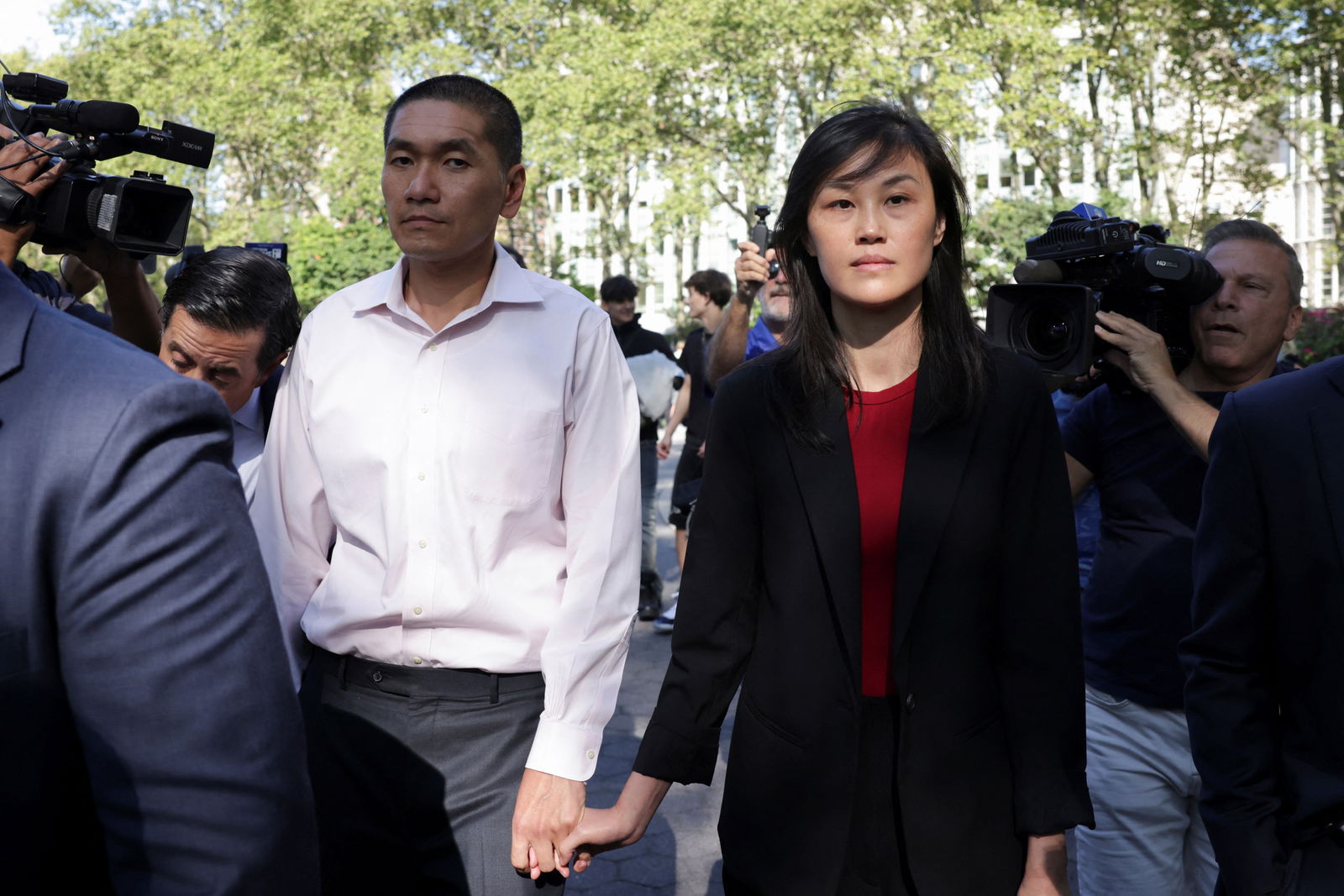 Linda Sun, a former aide to New York State Governor Kathy Hochul, exits Brooklyn federal court with Chris Hu after Linda was charged with acting as an unregistered agent of China's government, in New York City, Sept. 3, 2024.