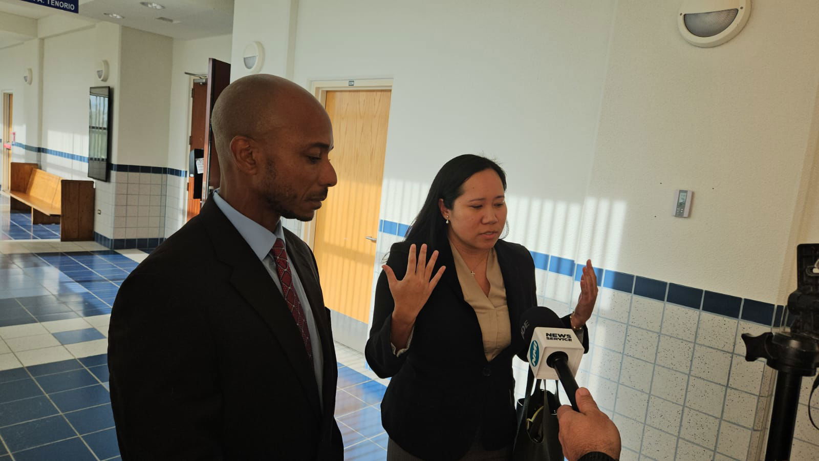 Chief Prosecutor Chester Hinds and Assistant Attorney General Frances Demapan talk to reporters after the jury found rape defendant William Abraczinskas guilty on Friday afternoon.