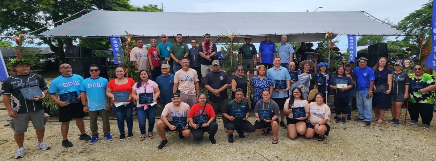 Gov. Arnold I. Palacios and Lt. Gov. David M. Apatang join the government employees of the year during the Labor Day celebration at Garapan Fishing Base on Sunday.
