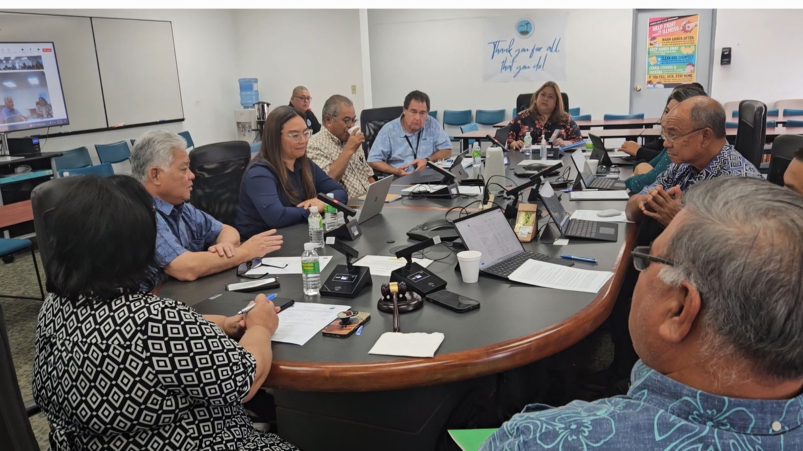 Gov. Arnold I. Palacios and Finance Secretary Tracy Norita meet with the Commonwealth Utilities Corporation board members and other officials on Thursday.