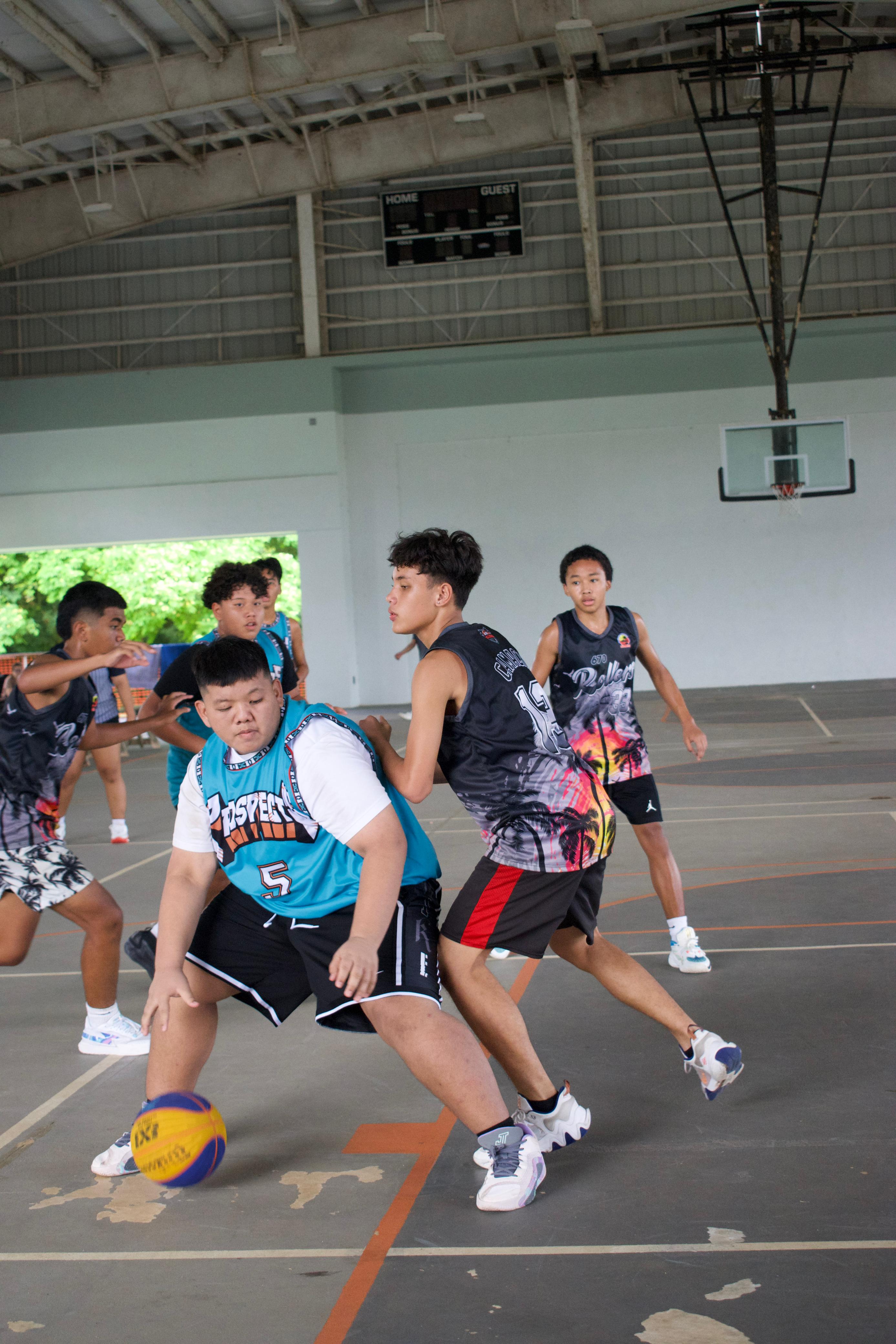 Team Prospects' DJ Apatang backs down a defender in the paint during a U14 division game of the Northern Mariana Islands Basketball Federation’s Back 2 School 3x3 Bash at the Koblerville gymnasium on Sunday. 