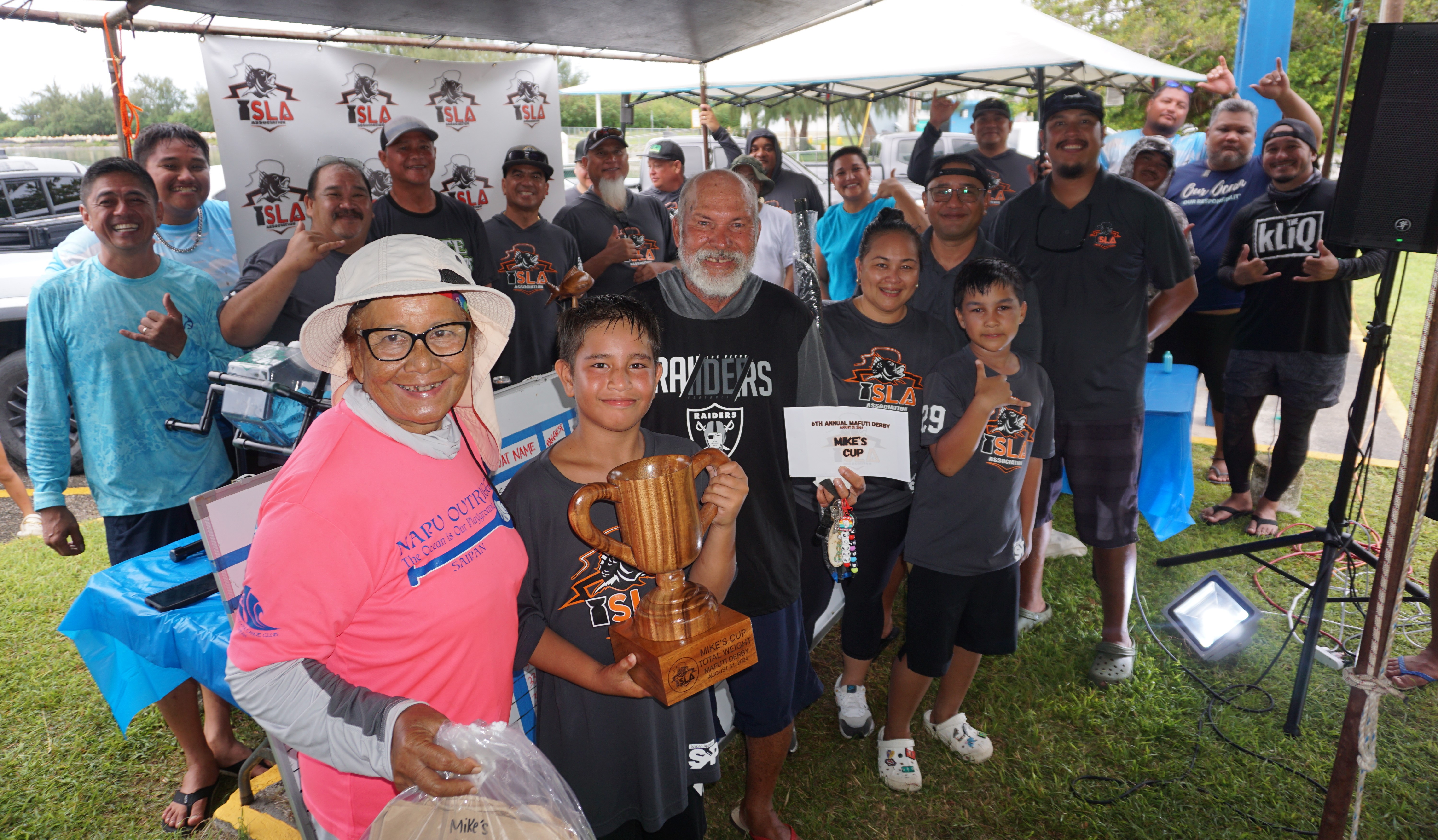 George Moses and Team RJ pose with the total weight trophy alongside  ISLA members at the conclusion of the I Sanhalom Laguna Anglers Association’s 6th Annual Mafuti Derby at Smiling Cove Marina on Saturday.