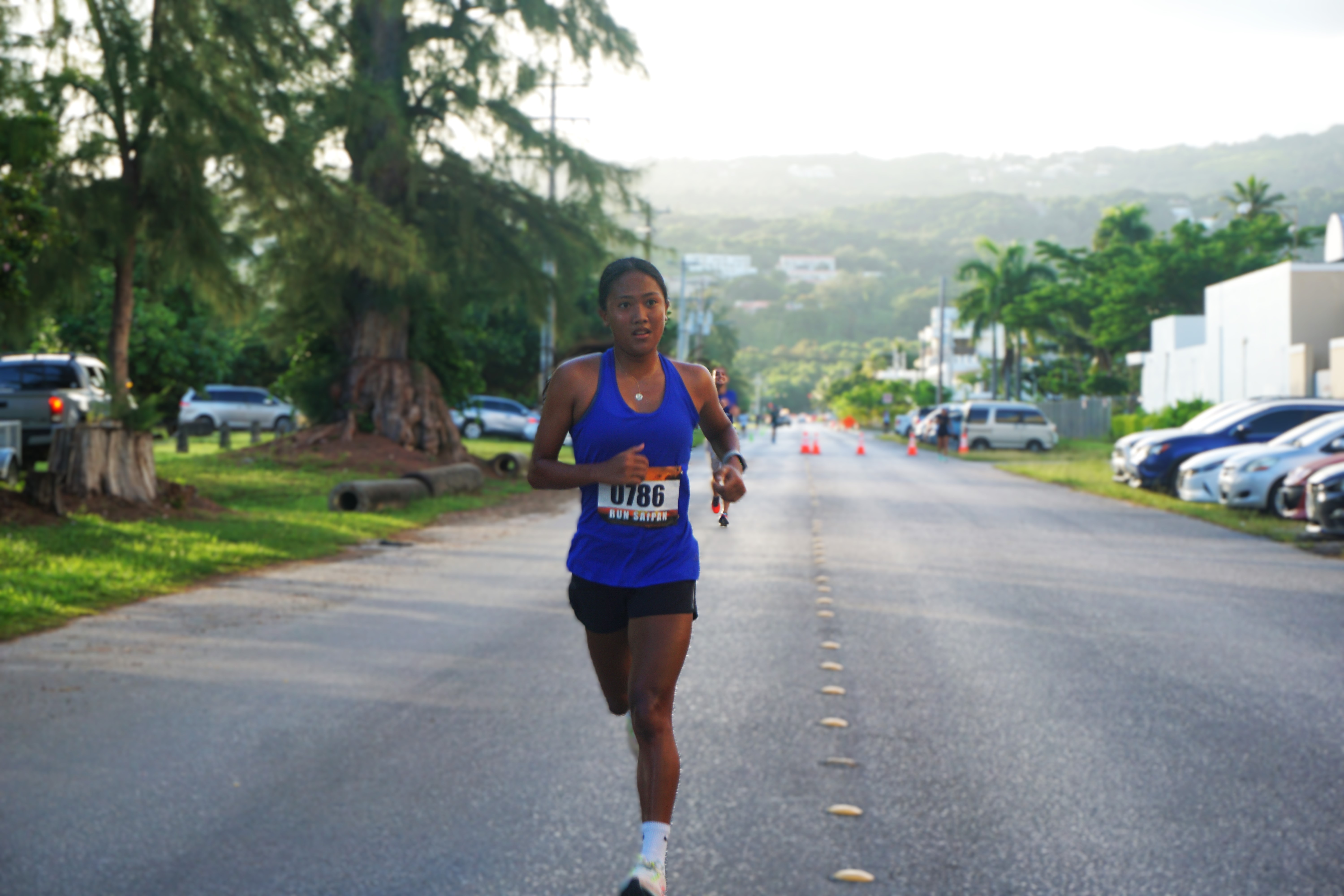 Kaithlyn Chavez smiles as she crosses the finish line of the 5K Fun Run of the Run Saipan Labor Day Half Marathon 2024 at American Memorial Park on Saturday.
