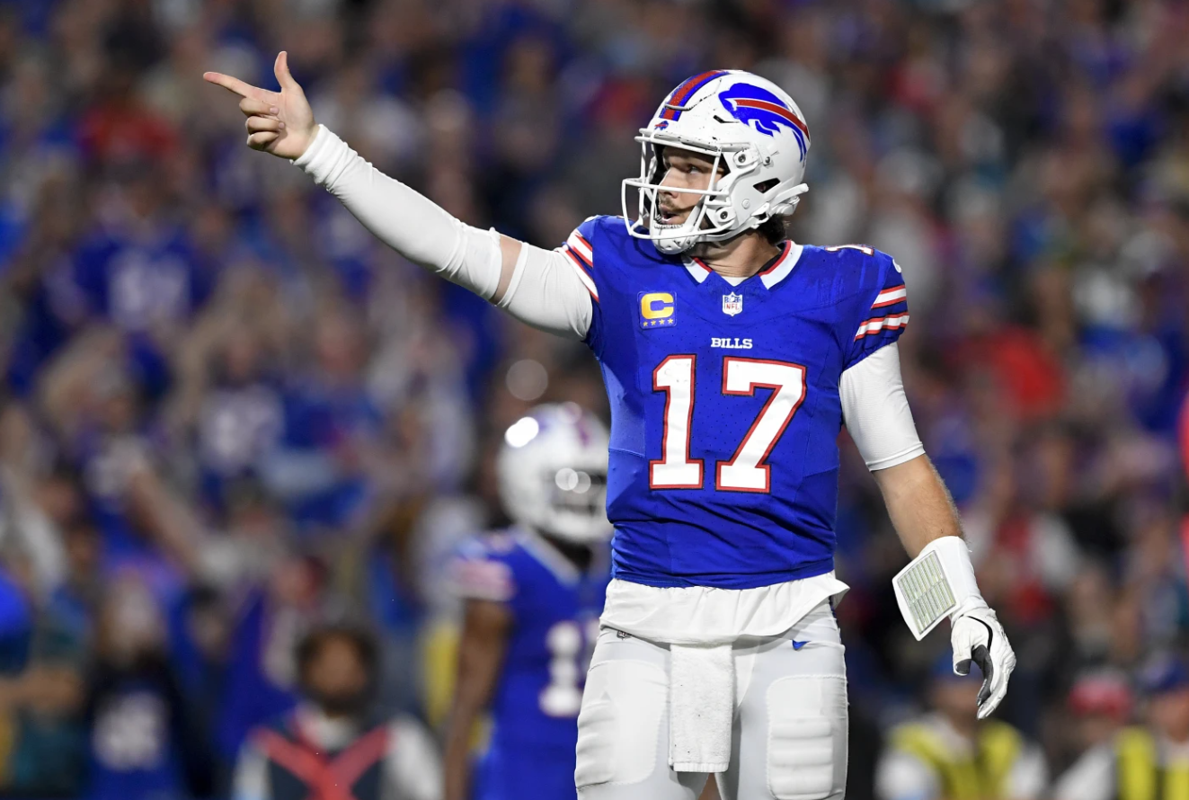 Buffalo Bills quarterback Josh Allen (17) signals for a first down during the first half of an NFL game against the Jacksonville Jaguars, Monday, Sept. 23, 2024 in Orchard Park, NY.