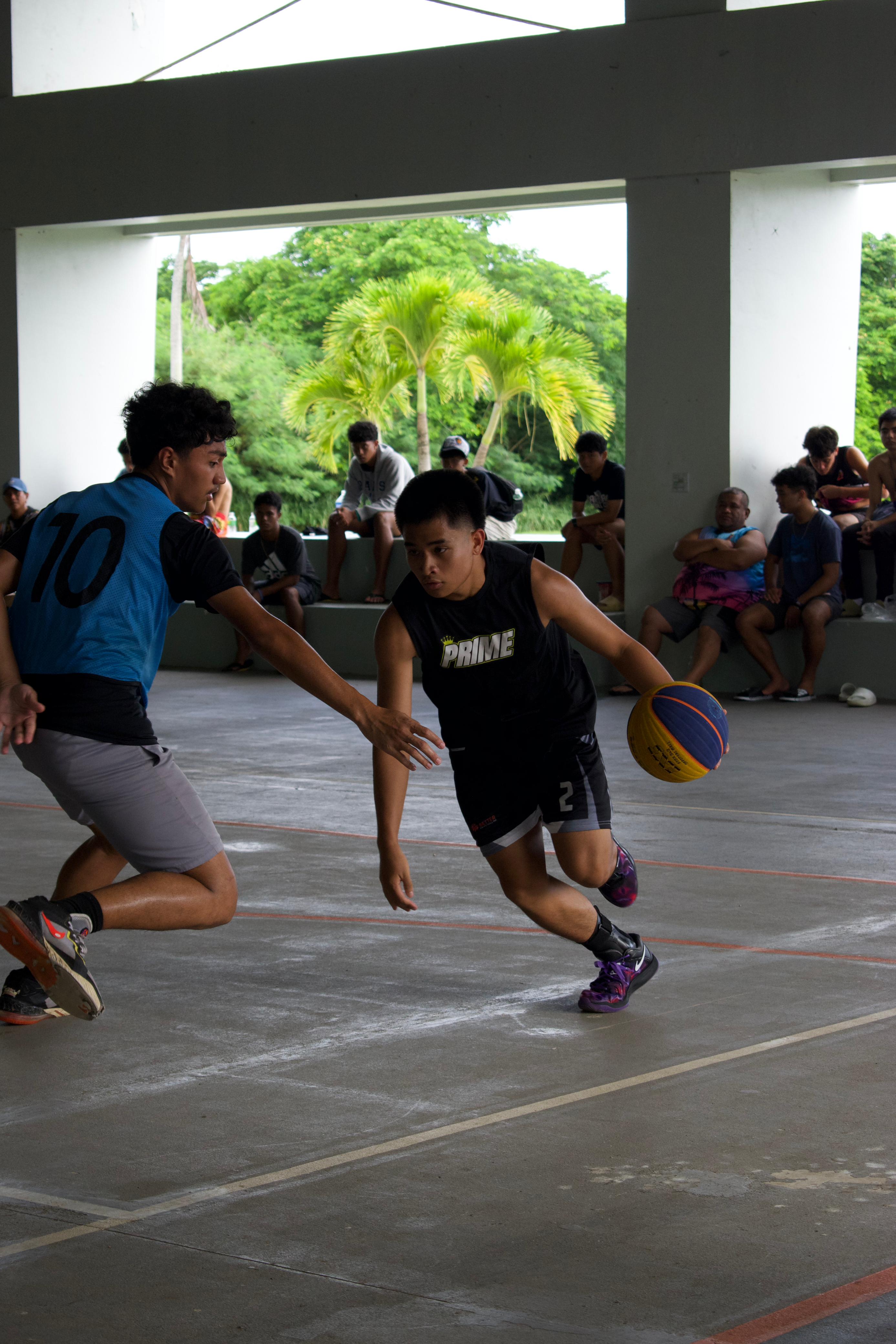 Team Prime's Mikee Mercado attempts a drive along the baseline during a game in the U17 division of the Northern Mariana Islands Basketball Federation’s Back 2 School 3x3 Bash, which concluded Sunday at the Koblerville gymnasium. 