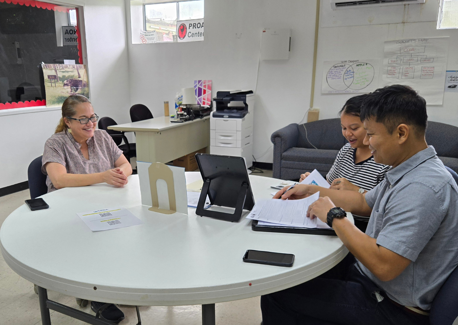 Alexis Hofschneider Kwon and Eric Kwon, K-Town Coffee co-owner, with Marie Coleman, CEDA loan manager.