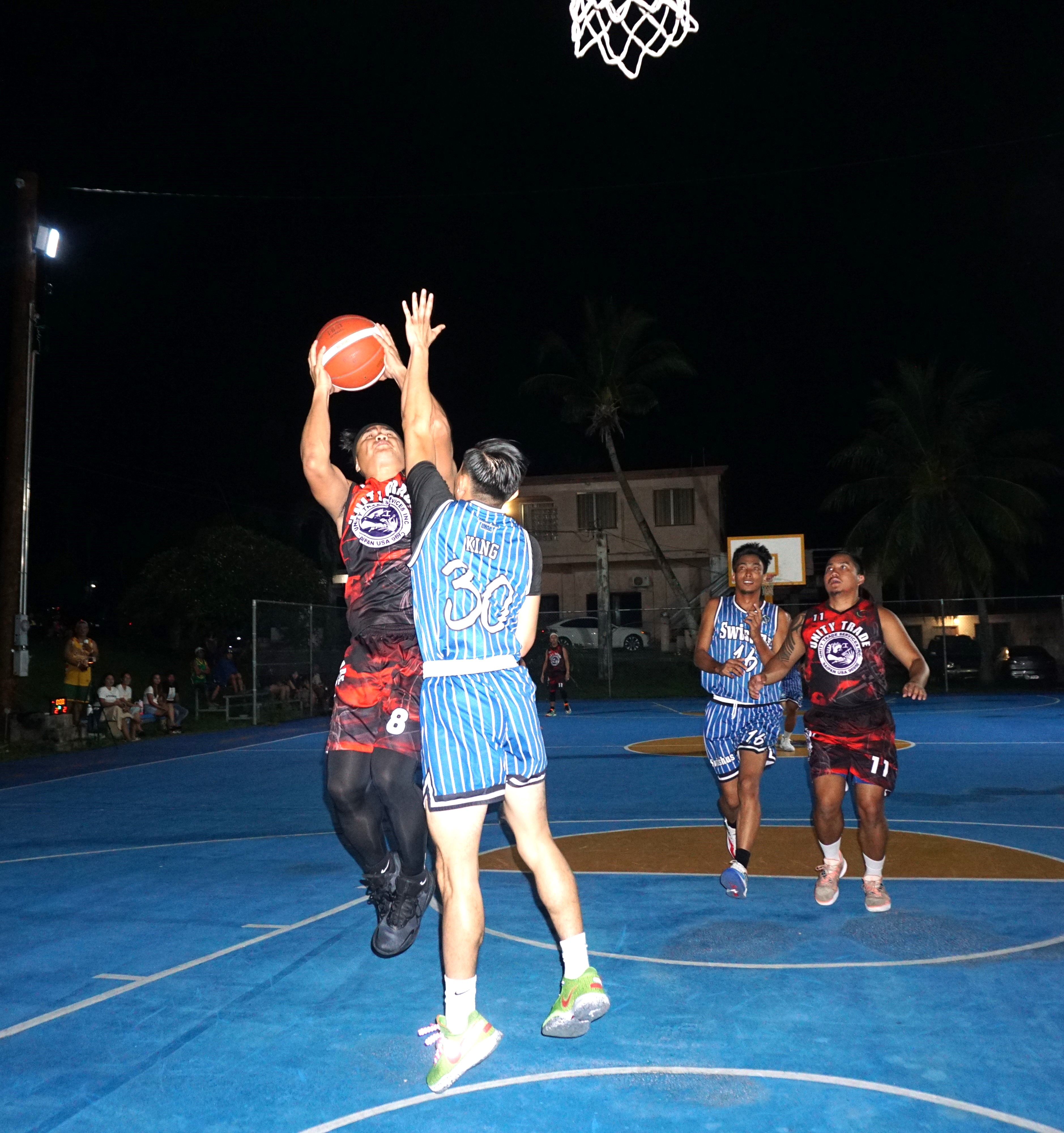 Unity Trade's Ivan De Vero takes the contested shot over a defender during a game in the Win Pacific Corporation Invitational Basketball League 2024 at the Gualo Rai basketball court.