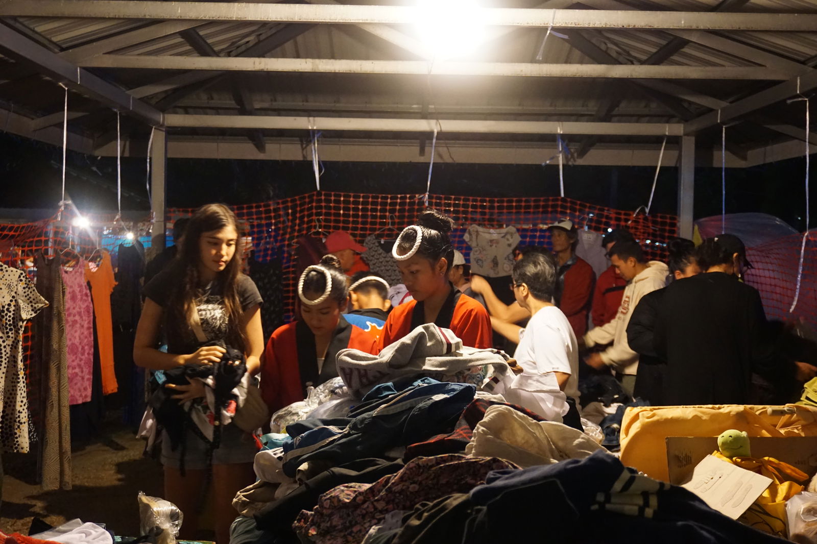Residents shop at the "garage sale" bazaar.