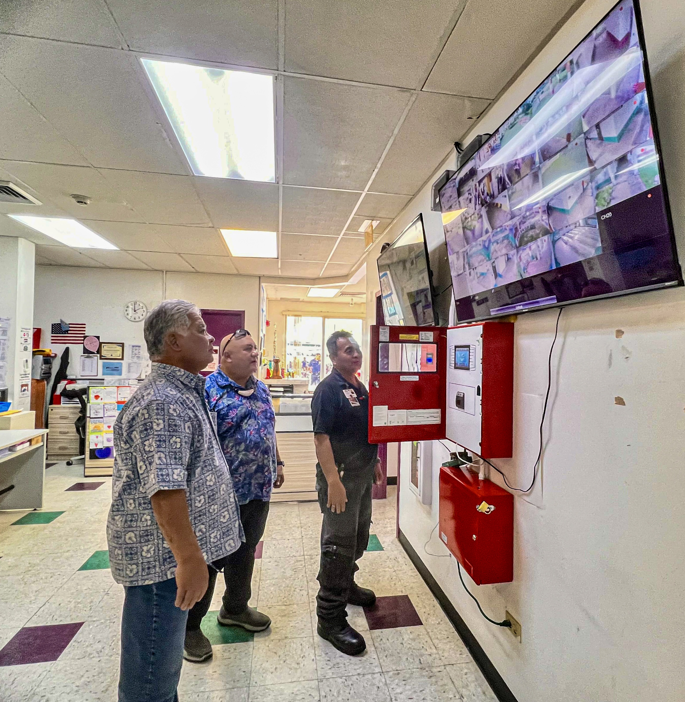Gov. Arnold I. Palacios and Commissioner of Education Dr. Lawrence F. Camacho witnessed how the modern computerized alarm and security system works.