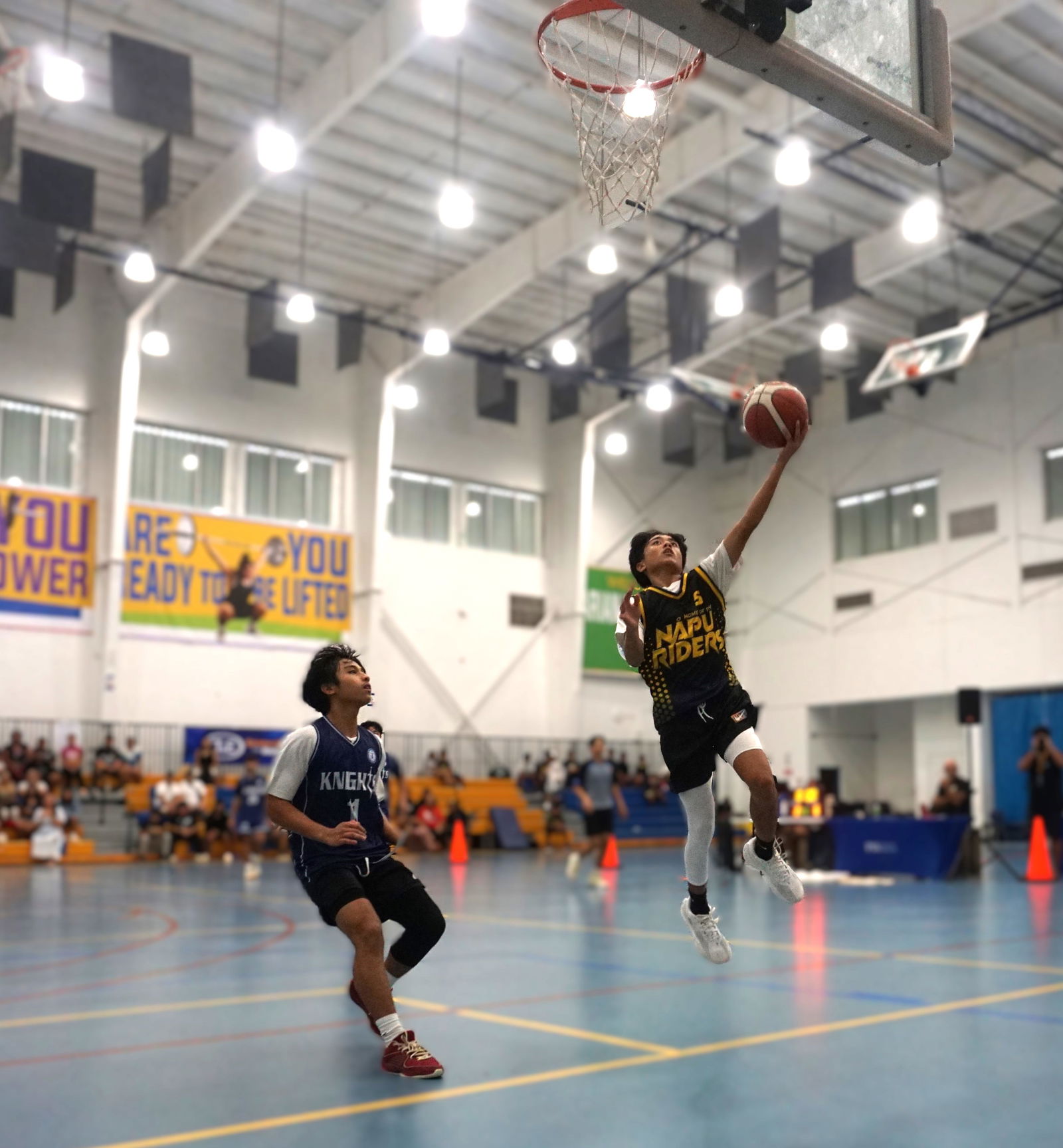FMS’ Jairus Pangilinan extends for the left-hand finish during the championship game against MCS in the boys middle school division of the PSS-NMIBF IT&E Interscholastic Basketball League SY24-25 at the Marianas High School gym on Saturday. 
